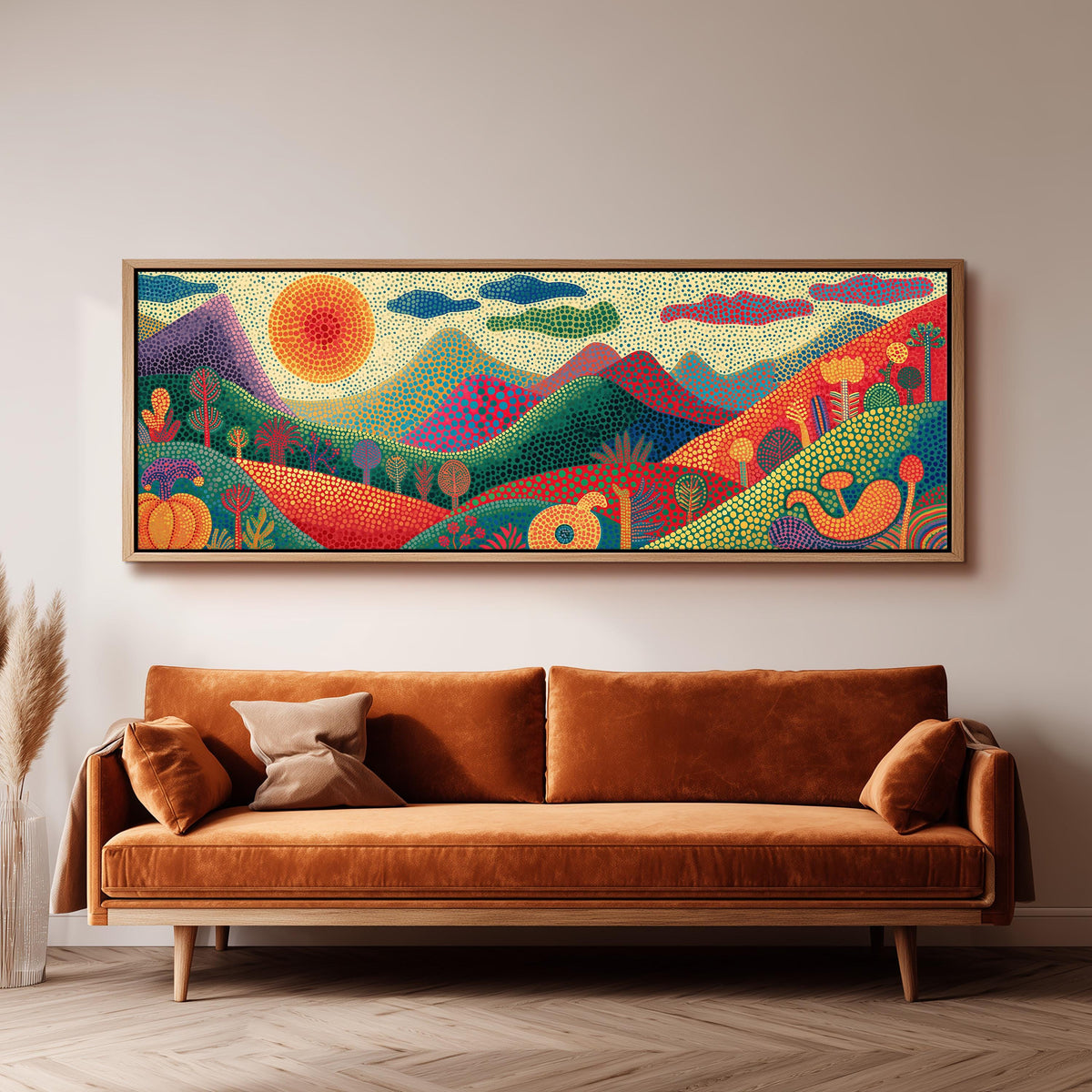 Dotted mountains under a sunburst panoramic canvas print above a sofa in a living room