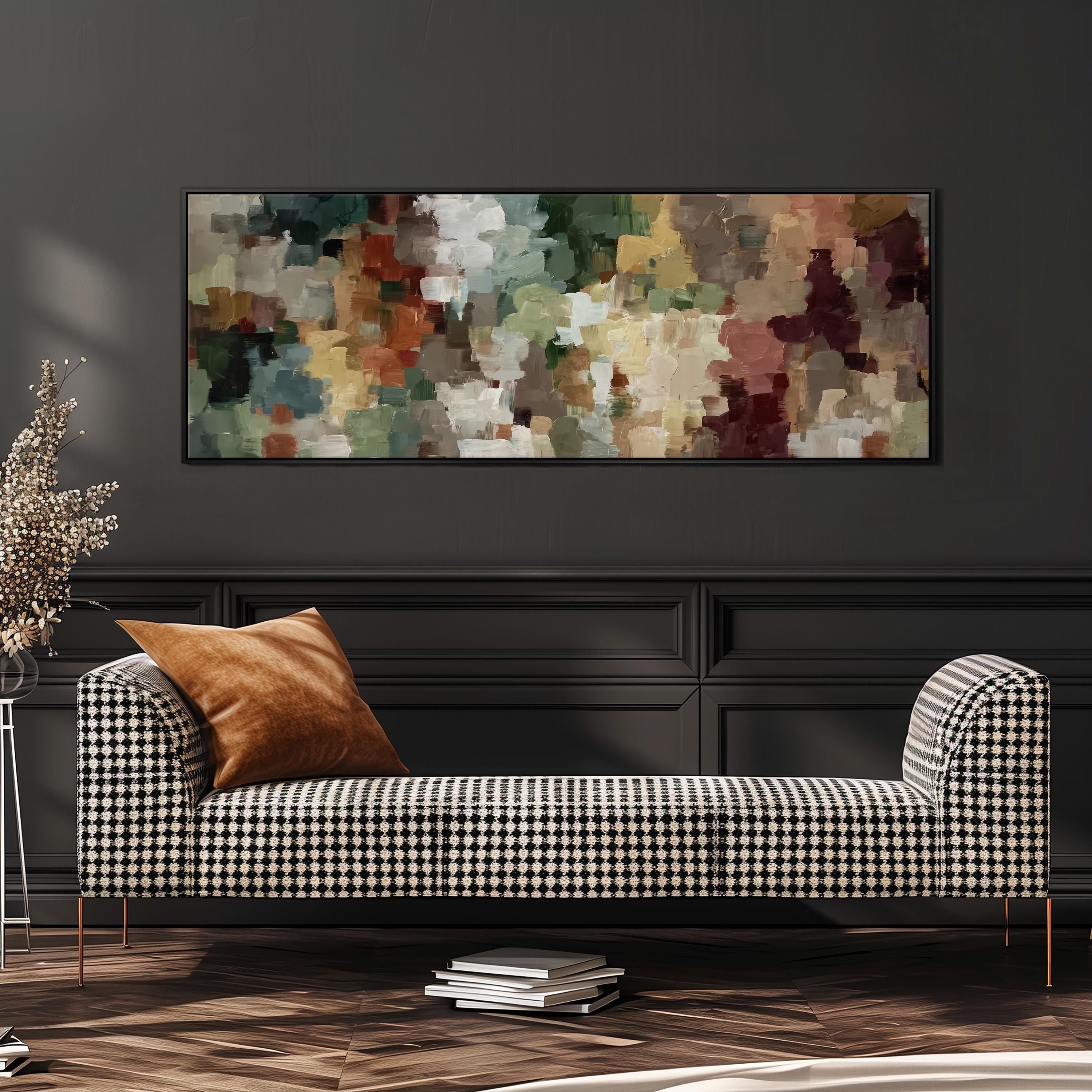 a modern living room with a black and white checkered sofa, a large abstract painting on the wall, and a stack of books on the floor.
