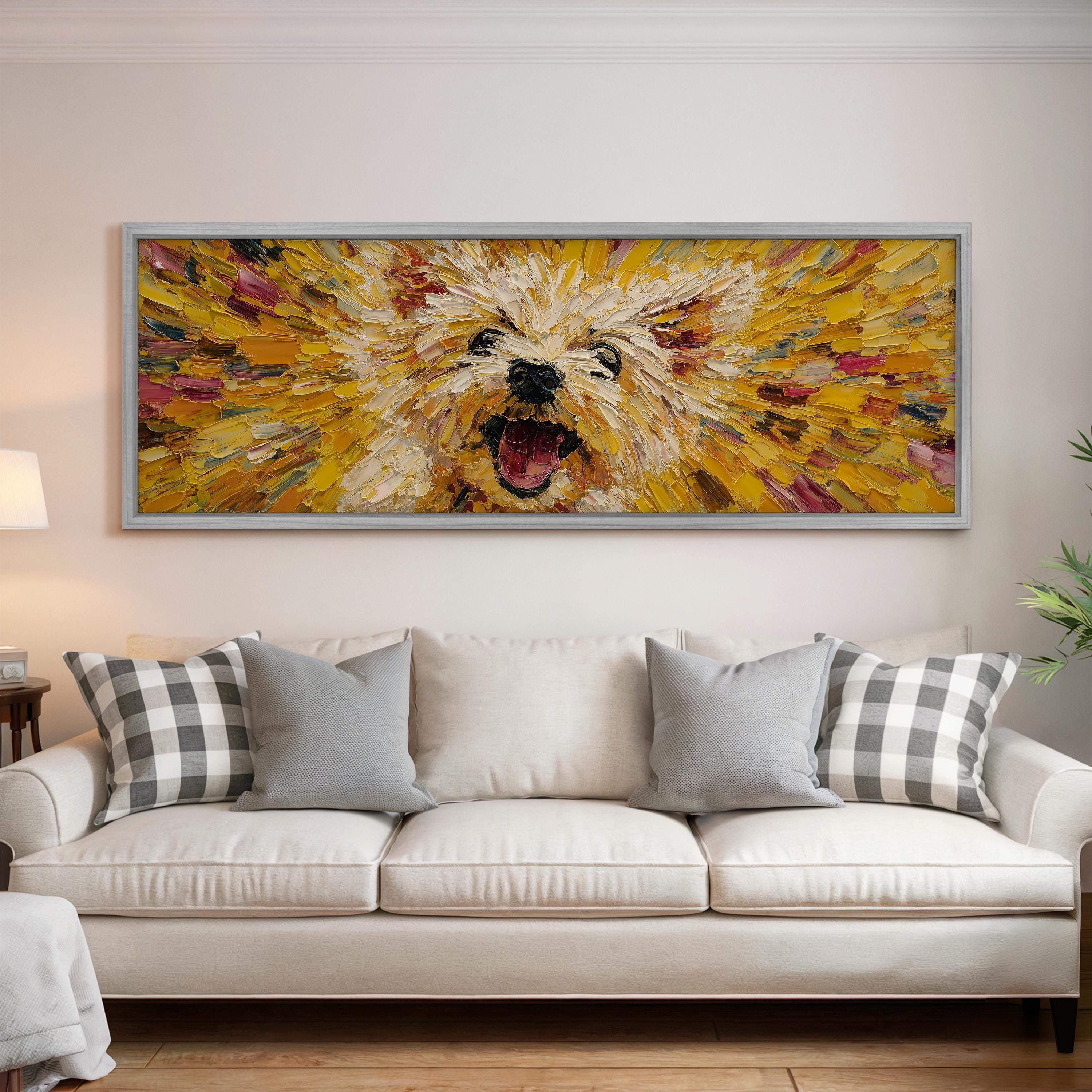 a large, colorful painting of a dog's face hanging on a wall above a white couch with gray and white plaid throw pillows.
