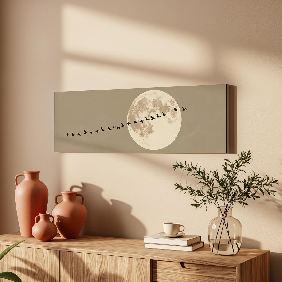Geese flying past a full moon long horizontal canvas print above a wooden sideboard