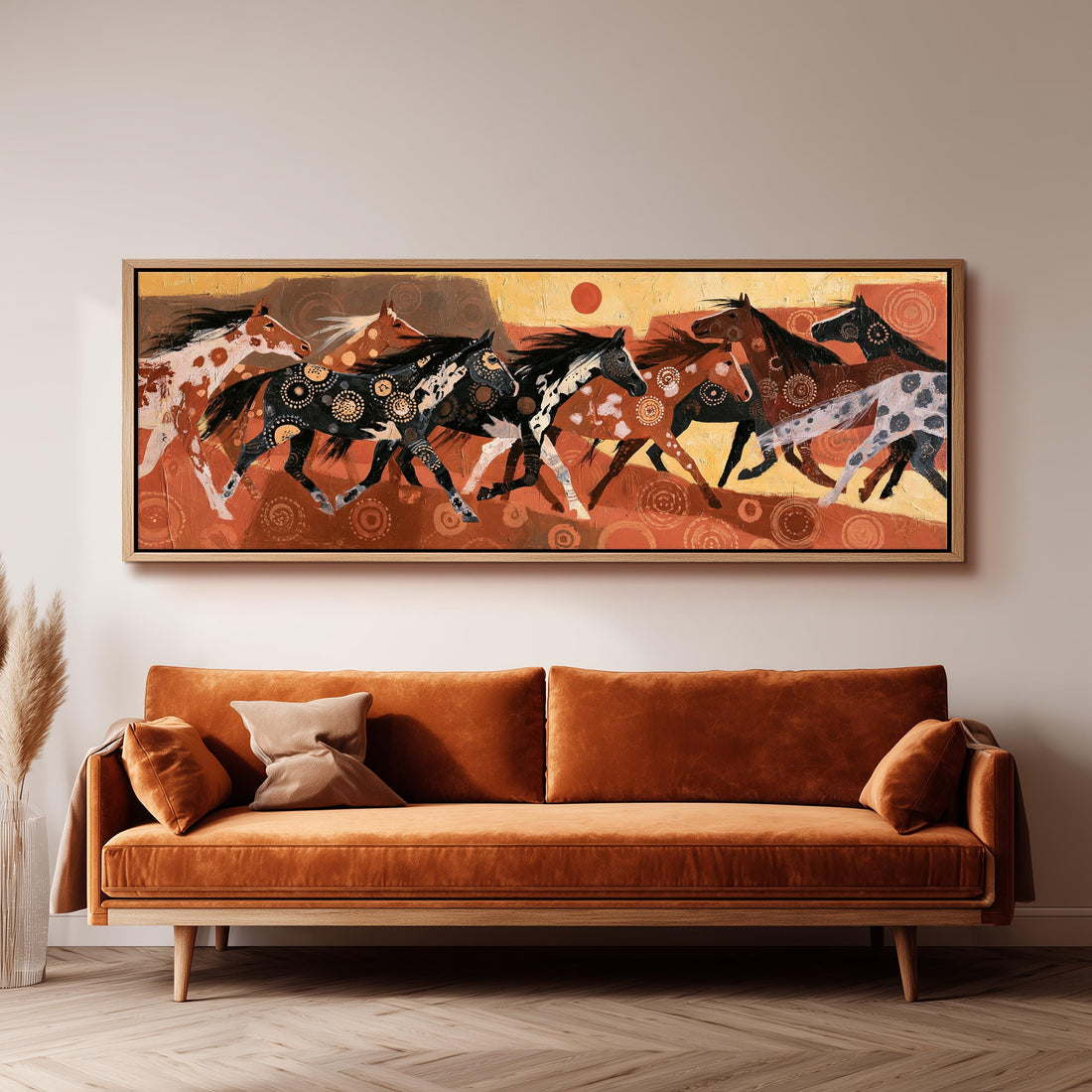 Patterned wild horse herd on rust long horizontal canvas print above a sofa in a living room