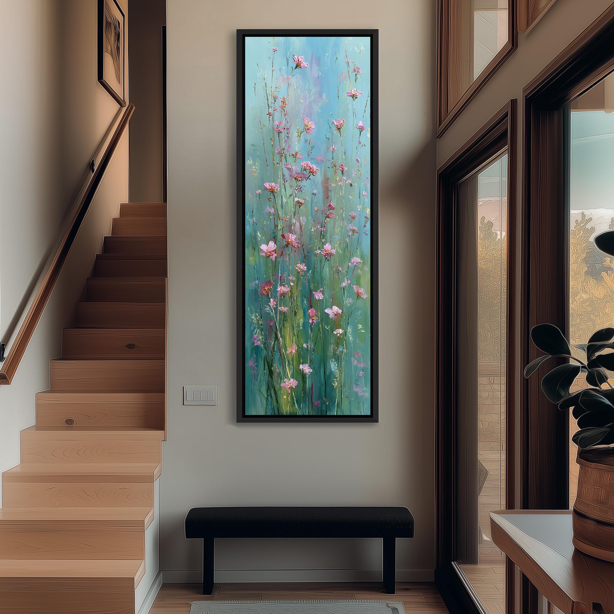 a large painting of pink flowers hanging on a wall in a hallway. The painting is framed and appears to be the focal point of the space. The hallway has a wooden staircase and a bench, creating a cozy and inviting atmosphere.