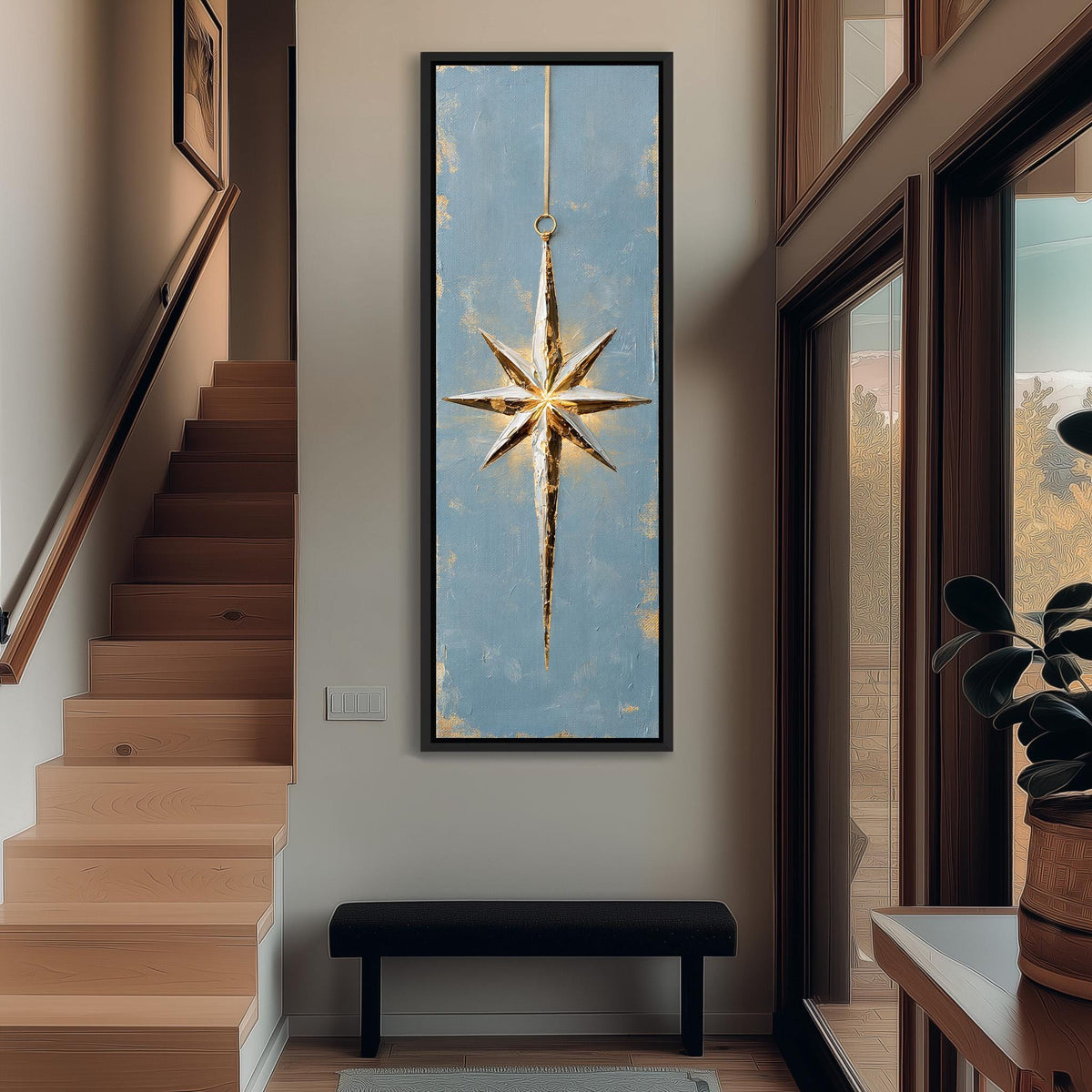 Gold and silver star ornament on blue tall narrow canvas print beside a staircase in an entryway