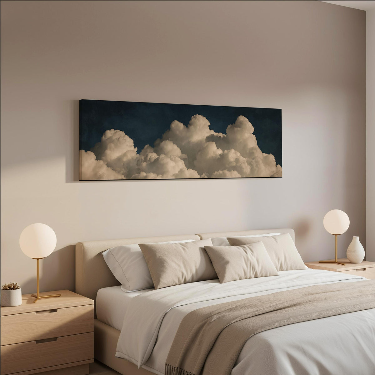 Cumulus clouds against a dark night sky wide panoramic canvas print above a bed in a neutral bedroom