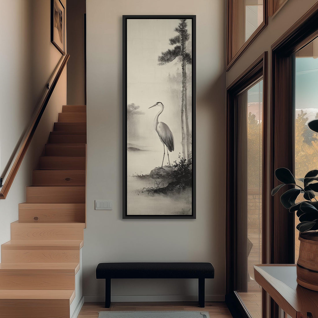 a hallway with a large black and white painting of a crane on the wall, a wooden staircase, a bench, and a plant.