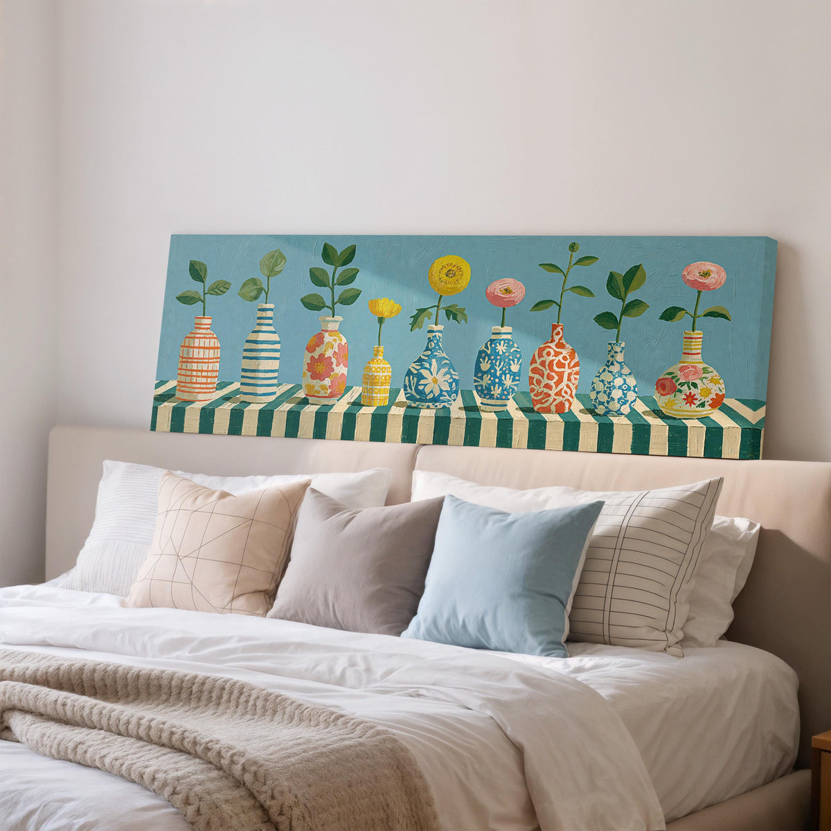 Row of striped vases with flowers wide panoramic canvas print above a bed in a bedroom