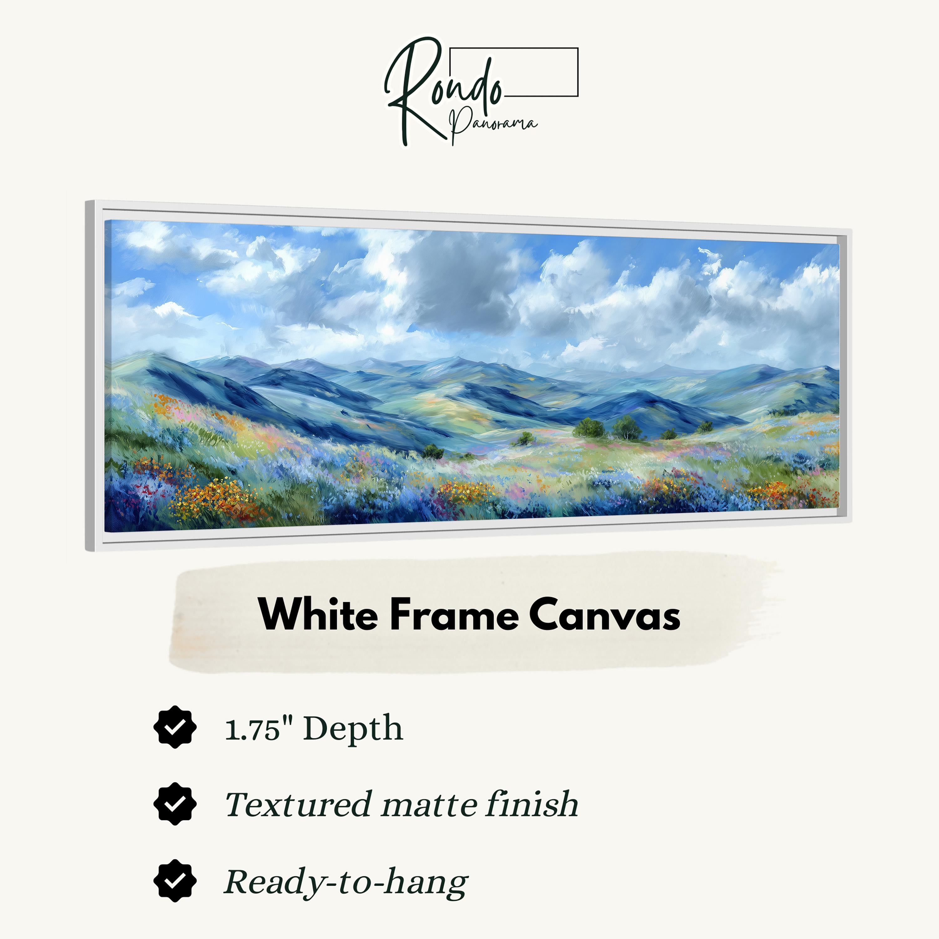 The image is a white frame canvas depicting a landscape with mountains, flowers, and a blue sky with clouds.