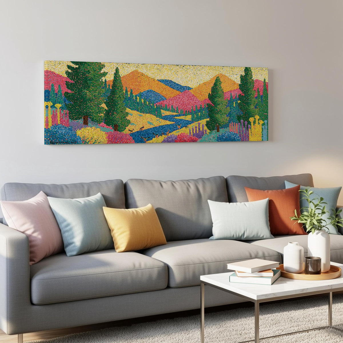 Colorful pine mountain valley panoramic canvas print above a grey sofa in a living room