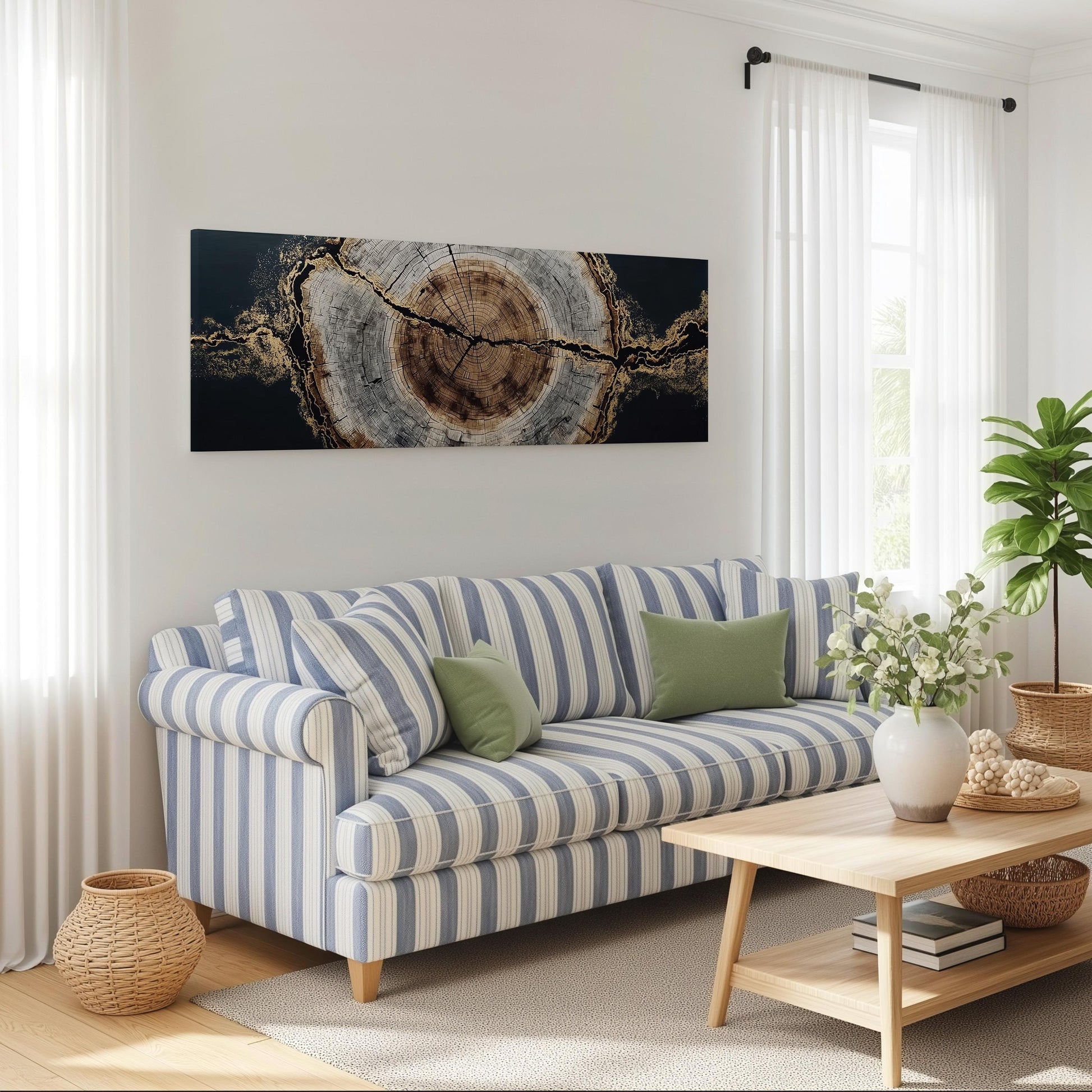 a cozy living room with a striped blue and white sofa, a wooden coffee table, and a large abstract painting on the wall.