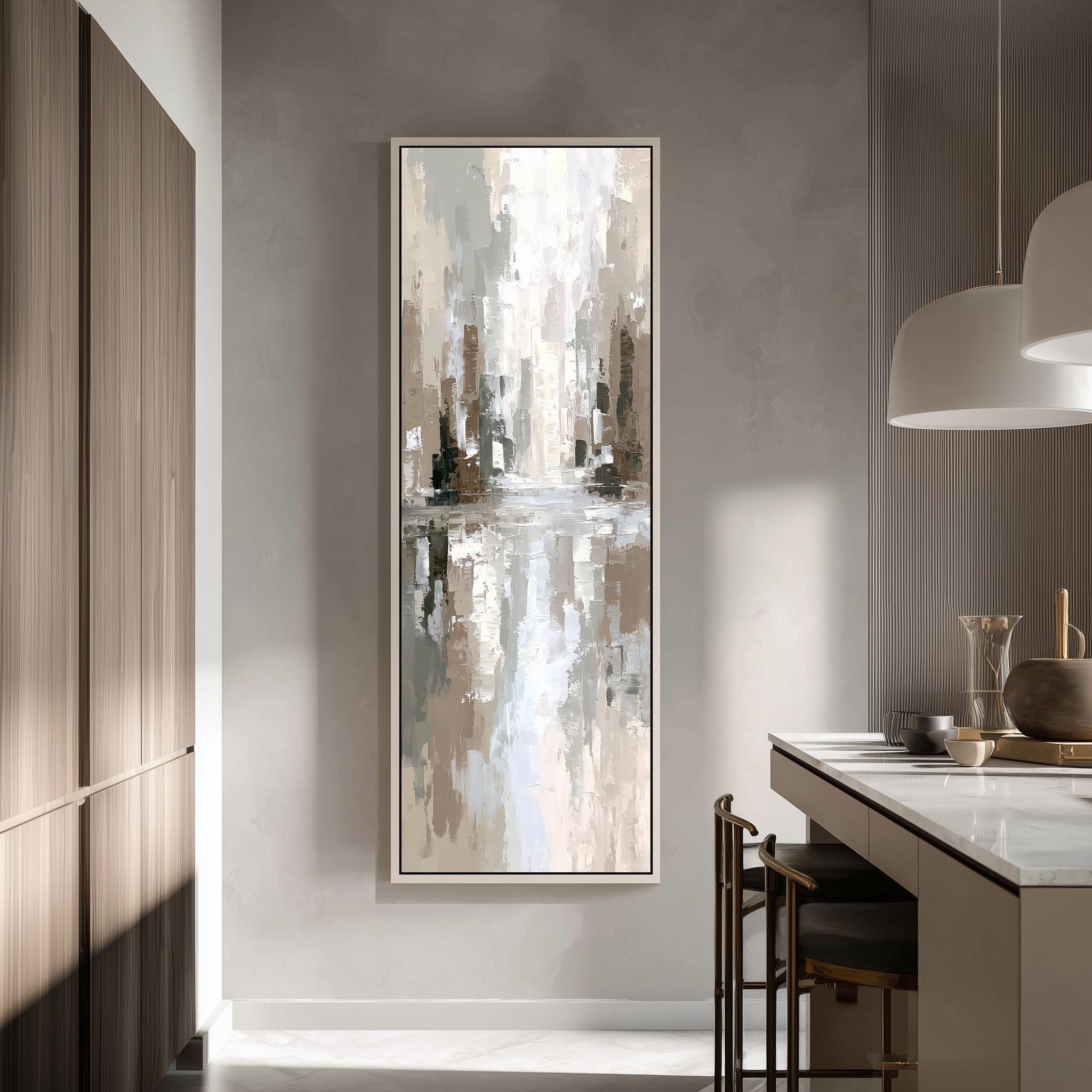 a modern kitchen with a large abstract painting hanging on the wall above a countertop with barstools.