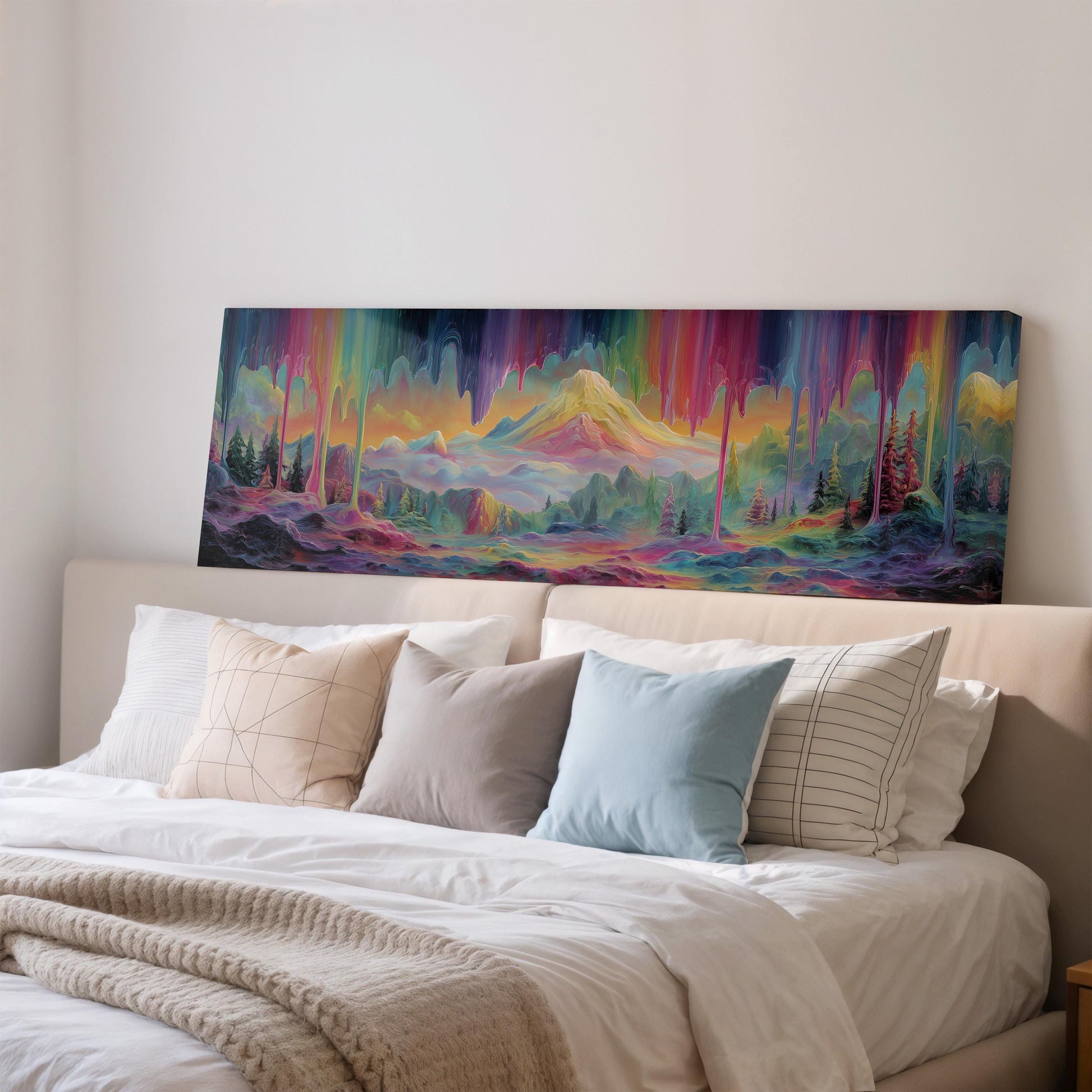 a large, colorful painting of a mountain landscape hanging on a wall above a bed with white bedding and pillows.