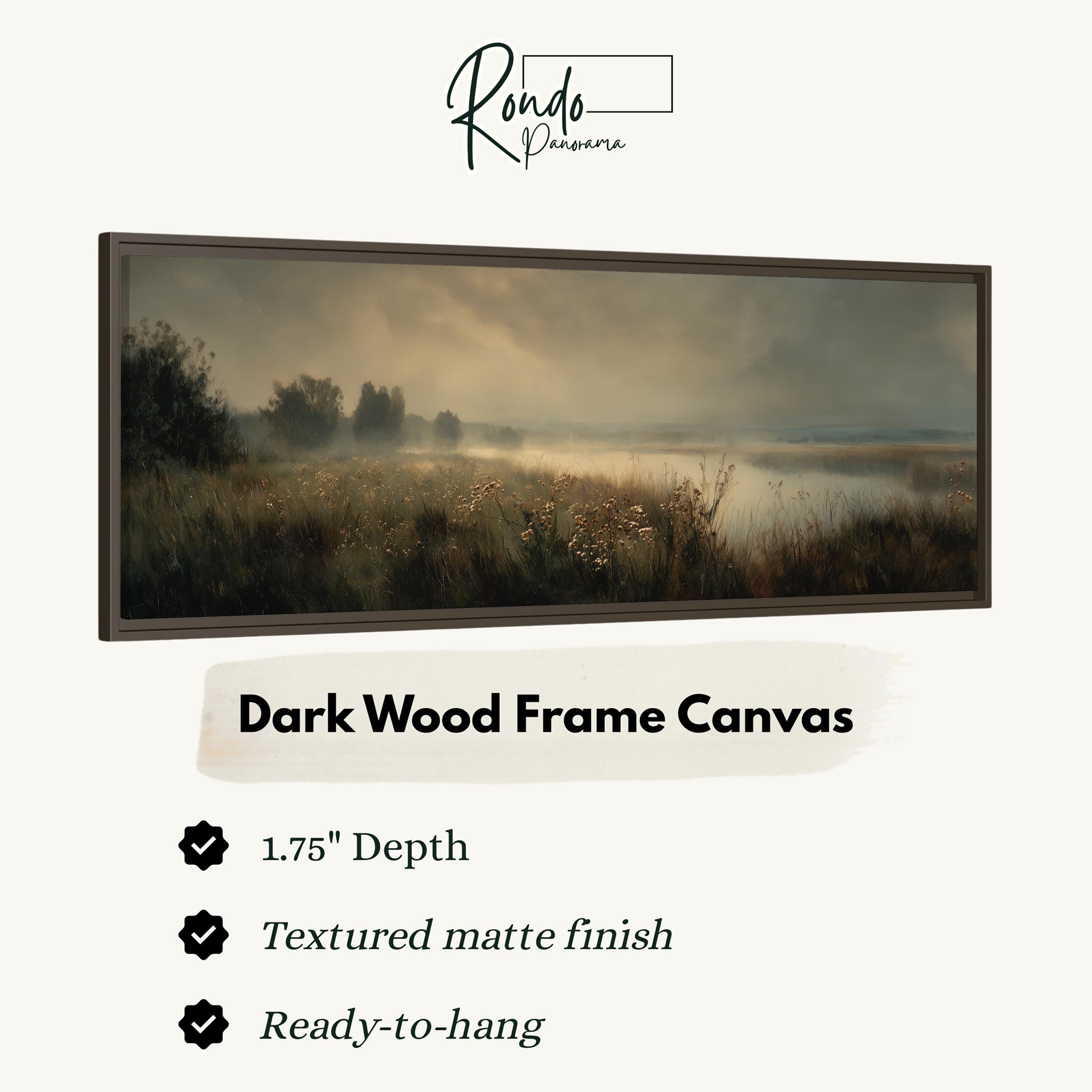 The image is a dark wood frame canvas depicting a serene landscape with a field of tall grass and a body of water in the distance.