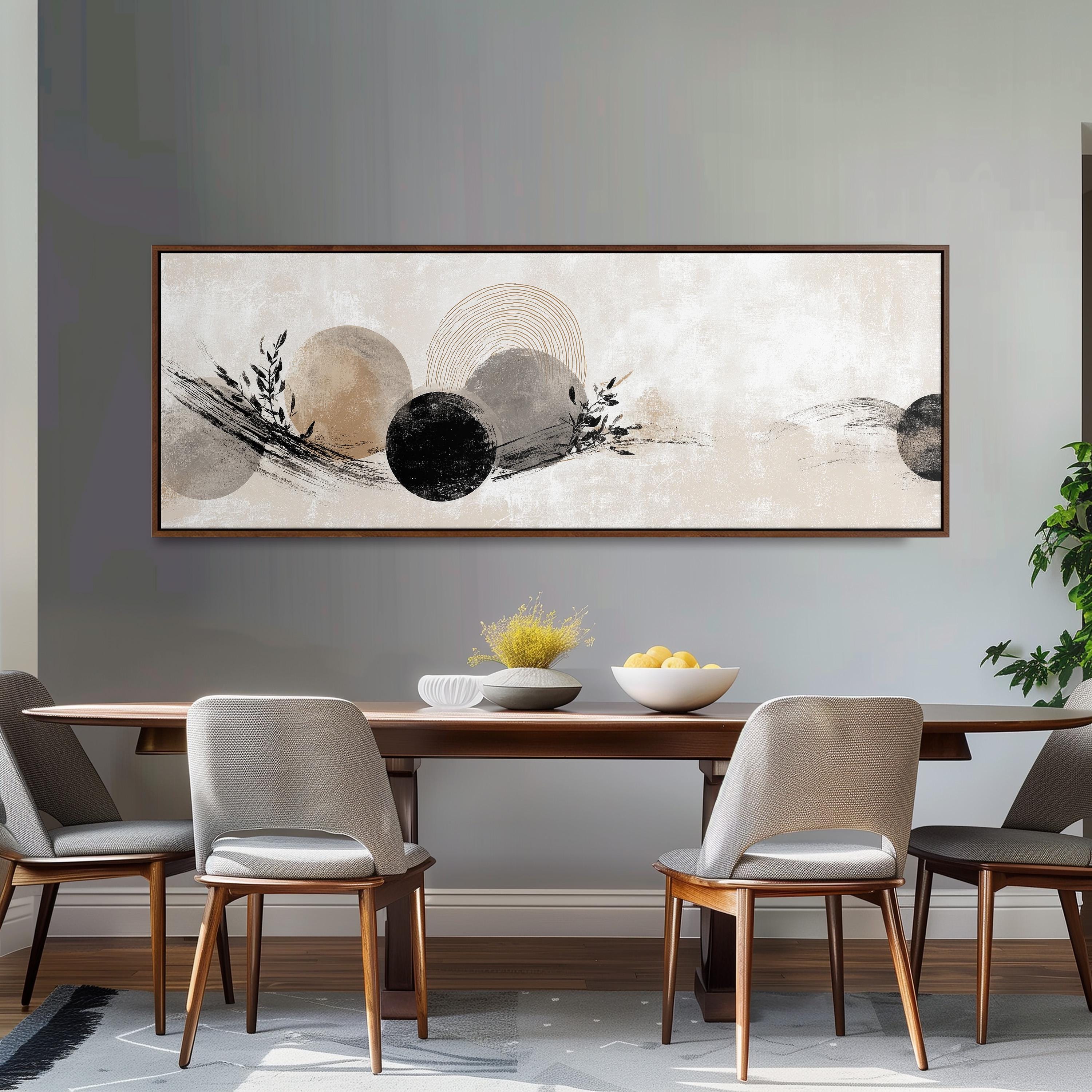 a modern dining room with a large abstract painting hanging on the wall above a wooden dining table with four chairs. The table is set with a bowl of fruit and a vase of flowers, creating a welcoming and stylish atmosphere.