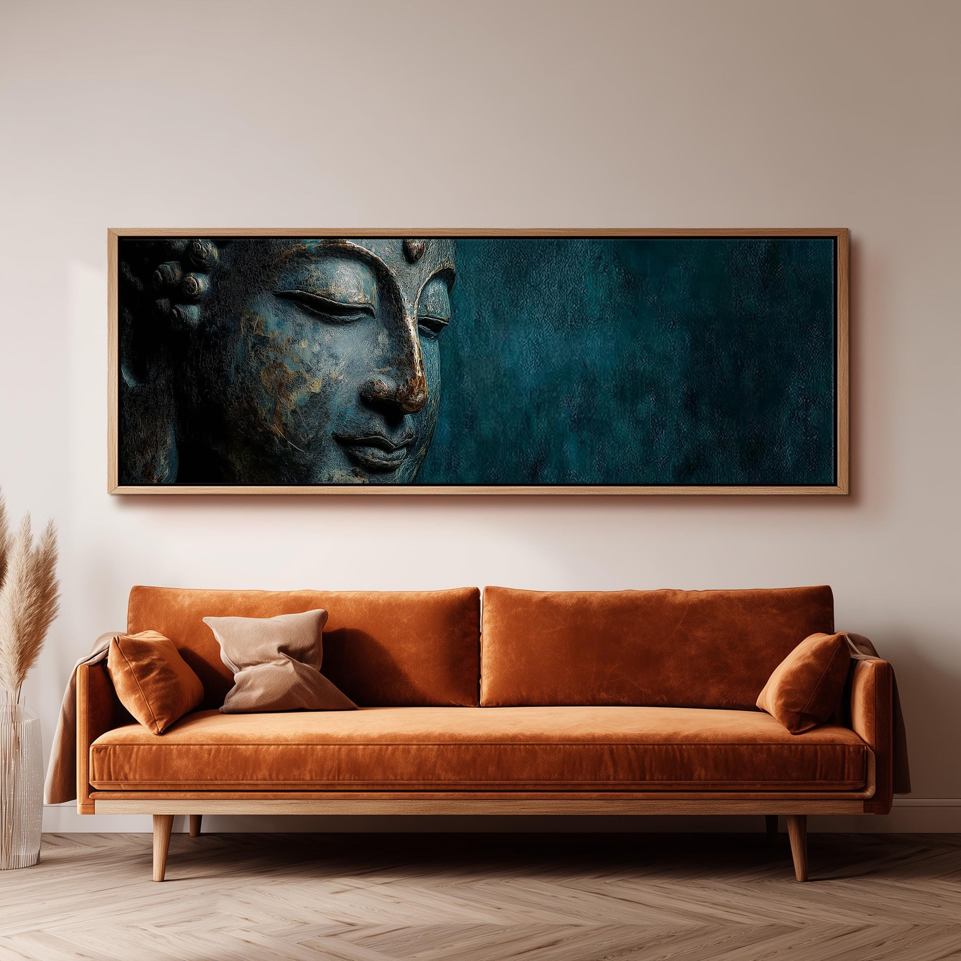 a large, ornate, and intricately detailed Buddha statue displayed on a wall above a brown sofa.