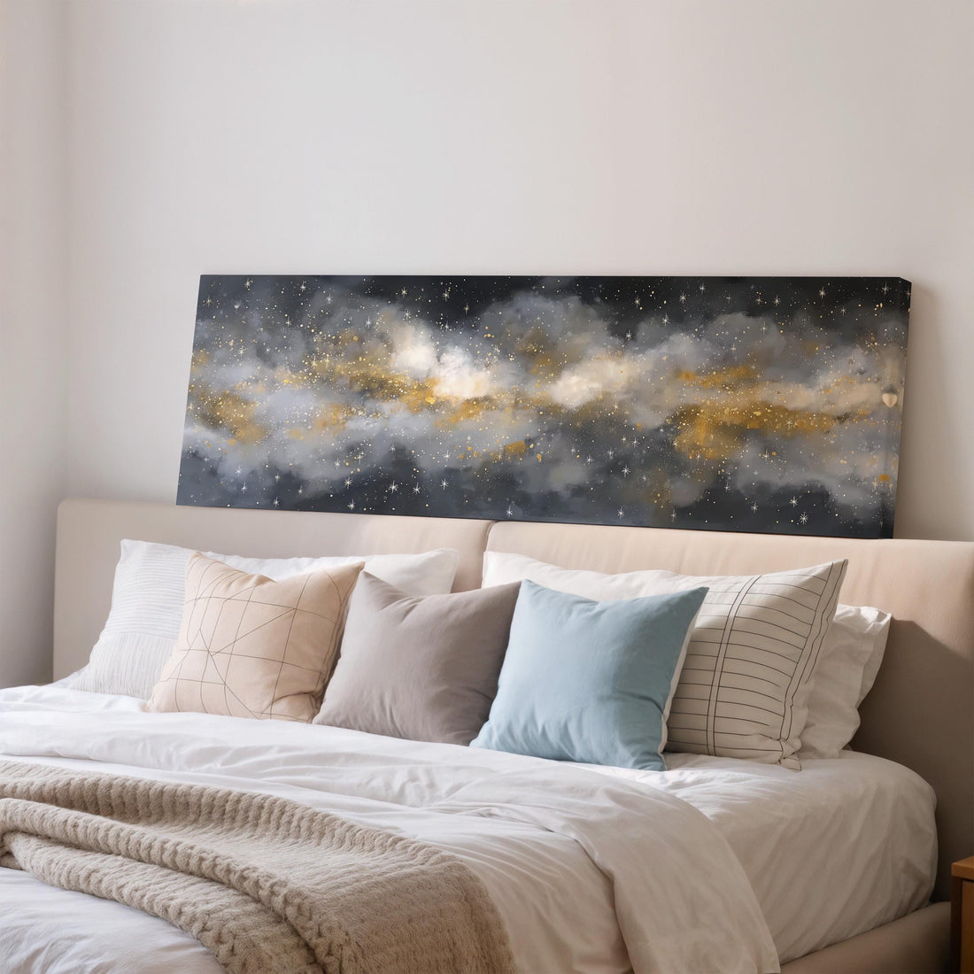 a black and white checkered sofa with a brown throw pillow, set against a dark wall with a large framed artwork depicting a starry night sky above.