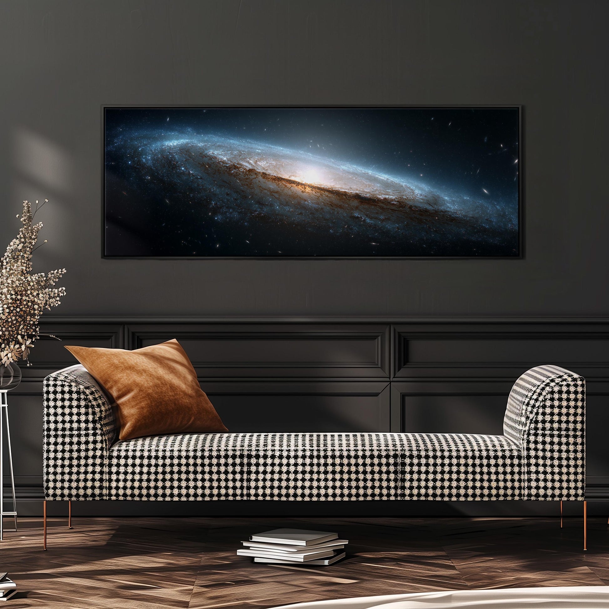 a large, black and white checkered sofa with a brown throw pillow, positioned in front of a wall with a framed image of a galaxy hanging above it.