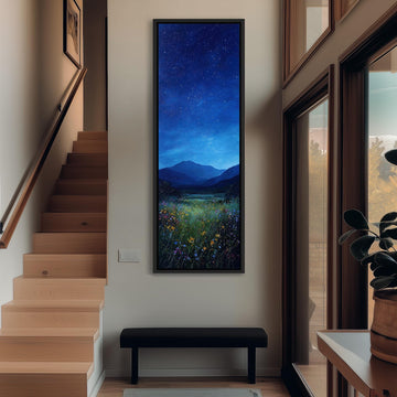 a large painting of a night sky with stars and a field of flowers hanging on the wall of a hallway.