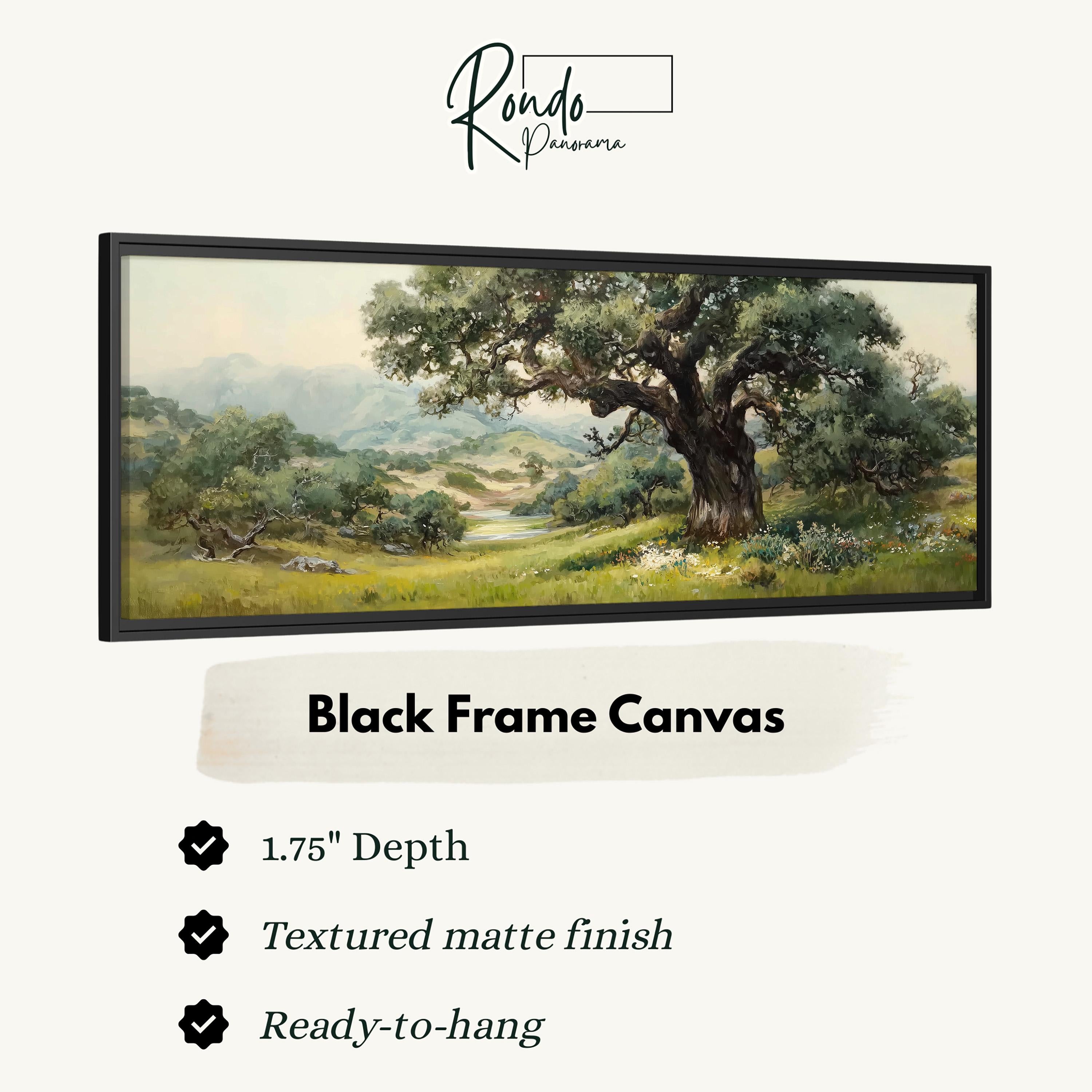 The image is a black frame canvas depicting a landscape with a large tree in the foreground and a grassy field in the background.