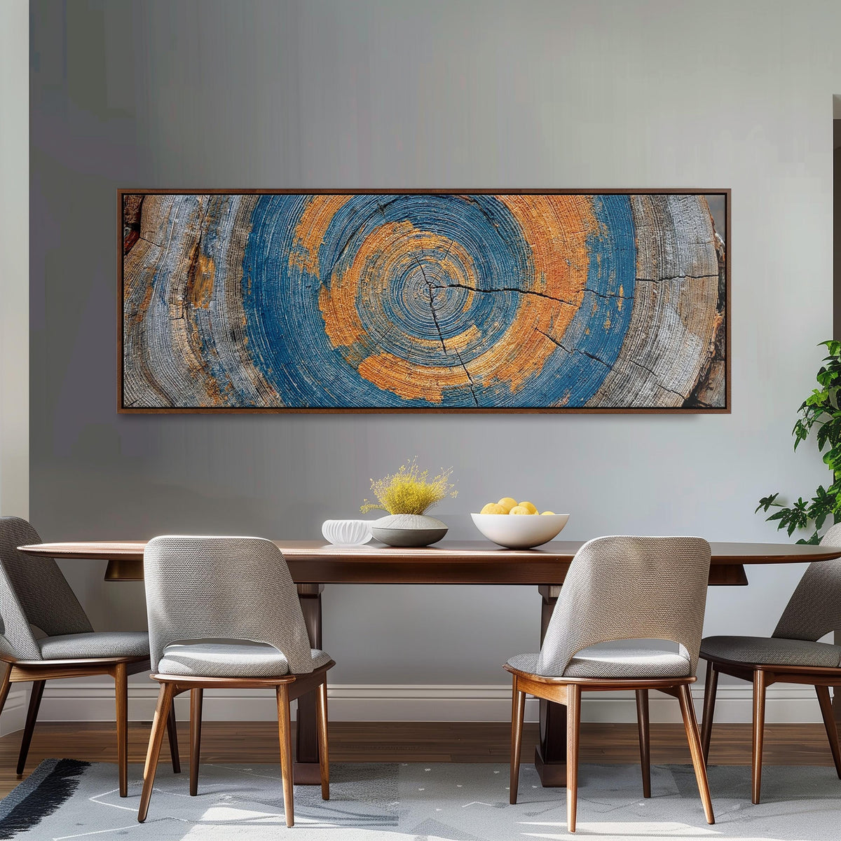 Blue and orange tree ring long horizontal canvas print above a dining table
