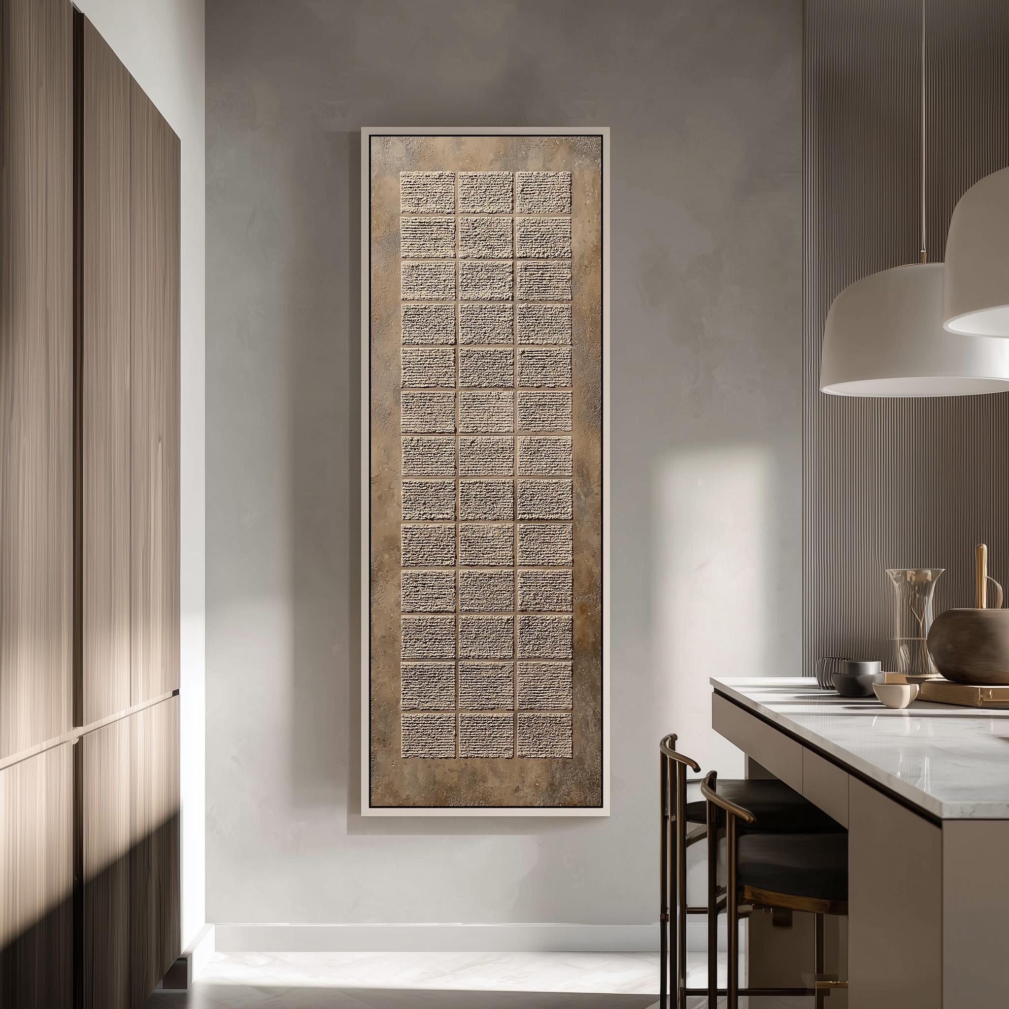 a modern kitchen with a large, rectangular wall art piece hanging above the counter. The kitchen has a minimalist design with a white countertop, wooden cabinets, and a pendant light above the counter.