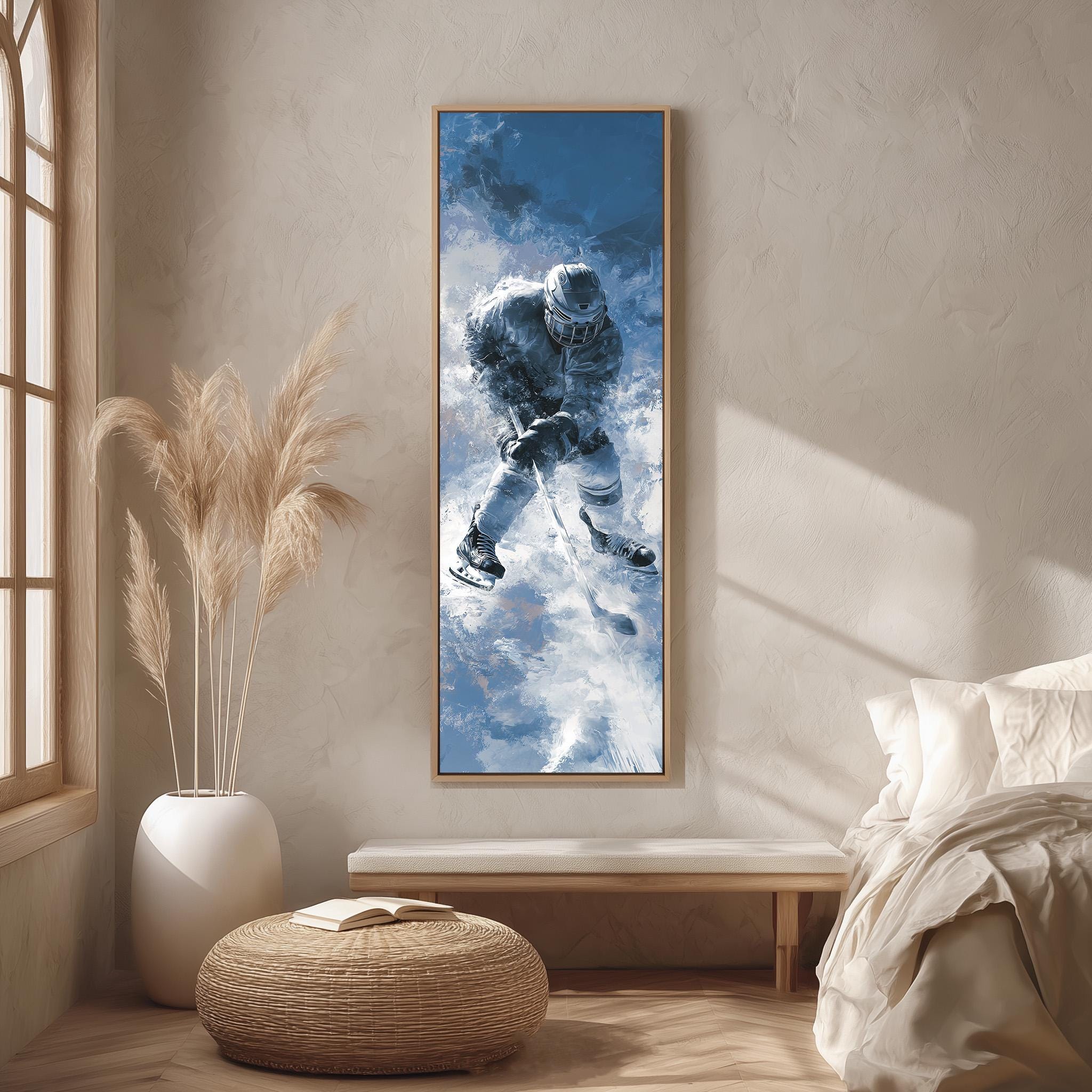 a large framed painting of a person skiing on a snowy mountain, hanging on a wall in a room with a bed, a potted plant, and a woven ottoman.