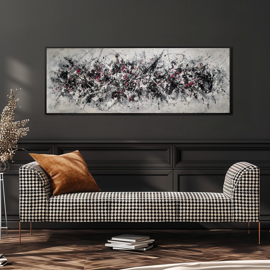 a large, abstract painting hanging on a wall above a white couch with gray and white patterned pillows.