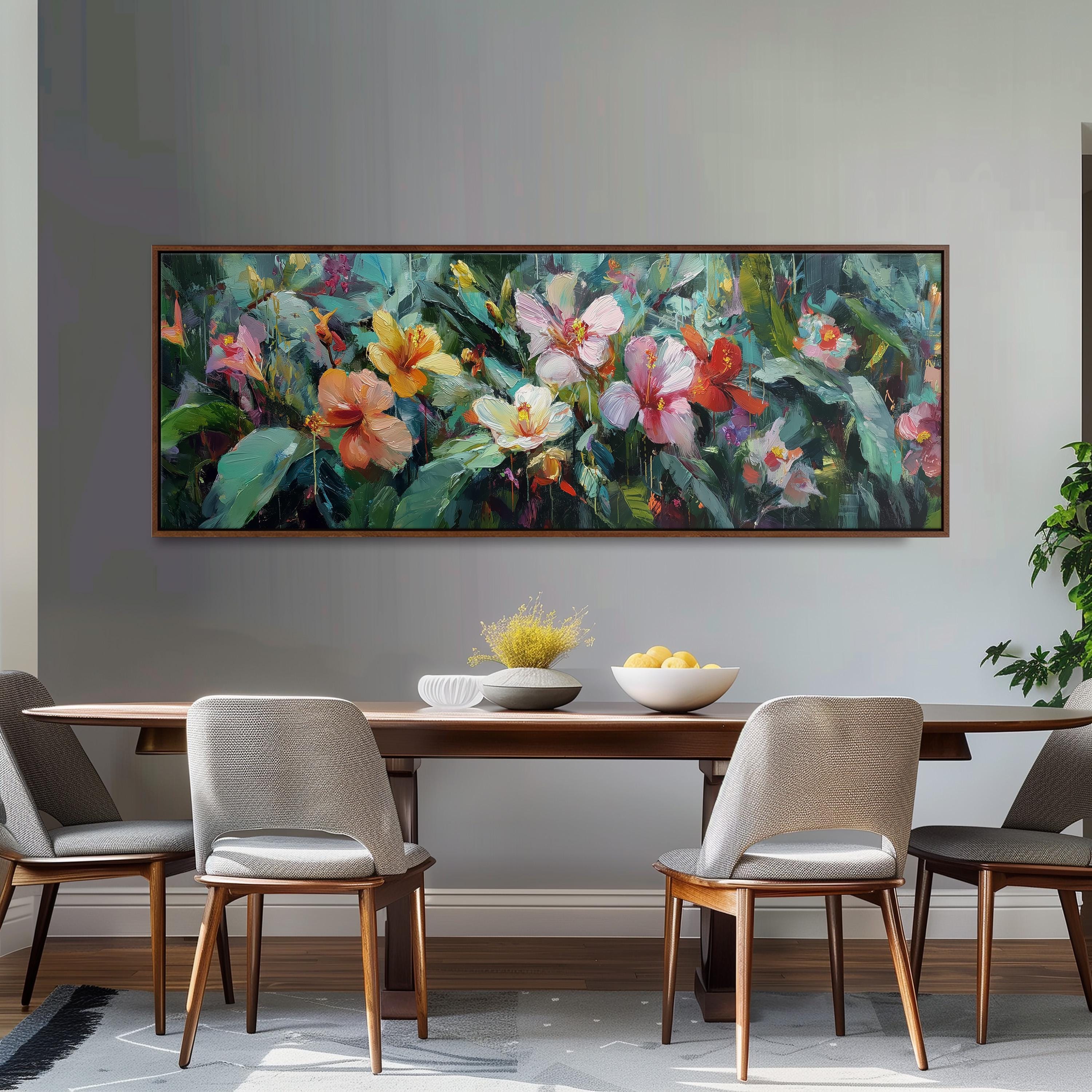 a dining room with a large painting of colorful flowers hanging on the wall above a wooden dining table with four chairs. The table is set with a bowl of fruit and a vase of flowers, creating a welcoming and vibrant atmosphere.