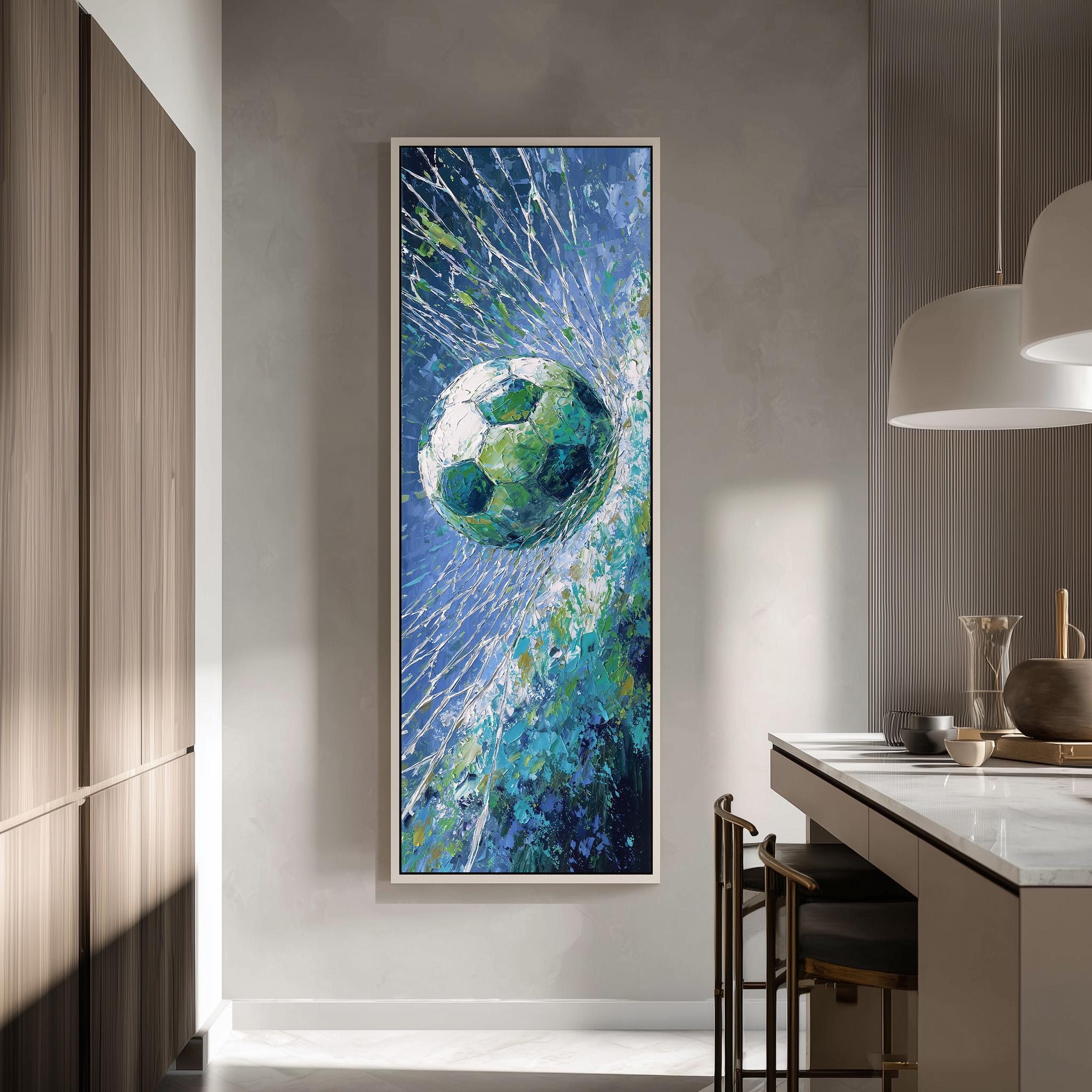 a large framed painting of a soccer ball in mid-air, surrounded by a vibrant blue and green background.