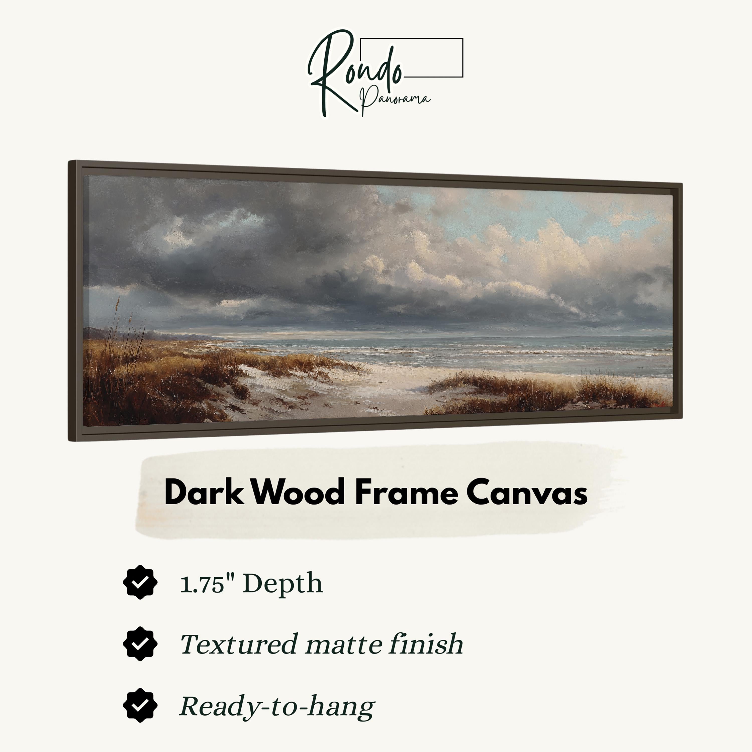 The image is a dark wood frame canvas depicting a serene landscape with a beach and cloudy sky.