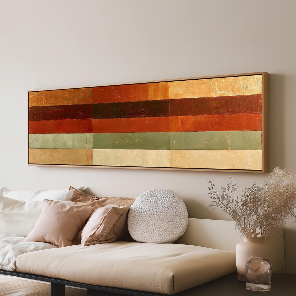 Amber, rust and sage horizontal color bands panoramic canvas print above a sofa in a living room