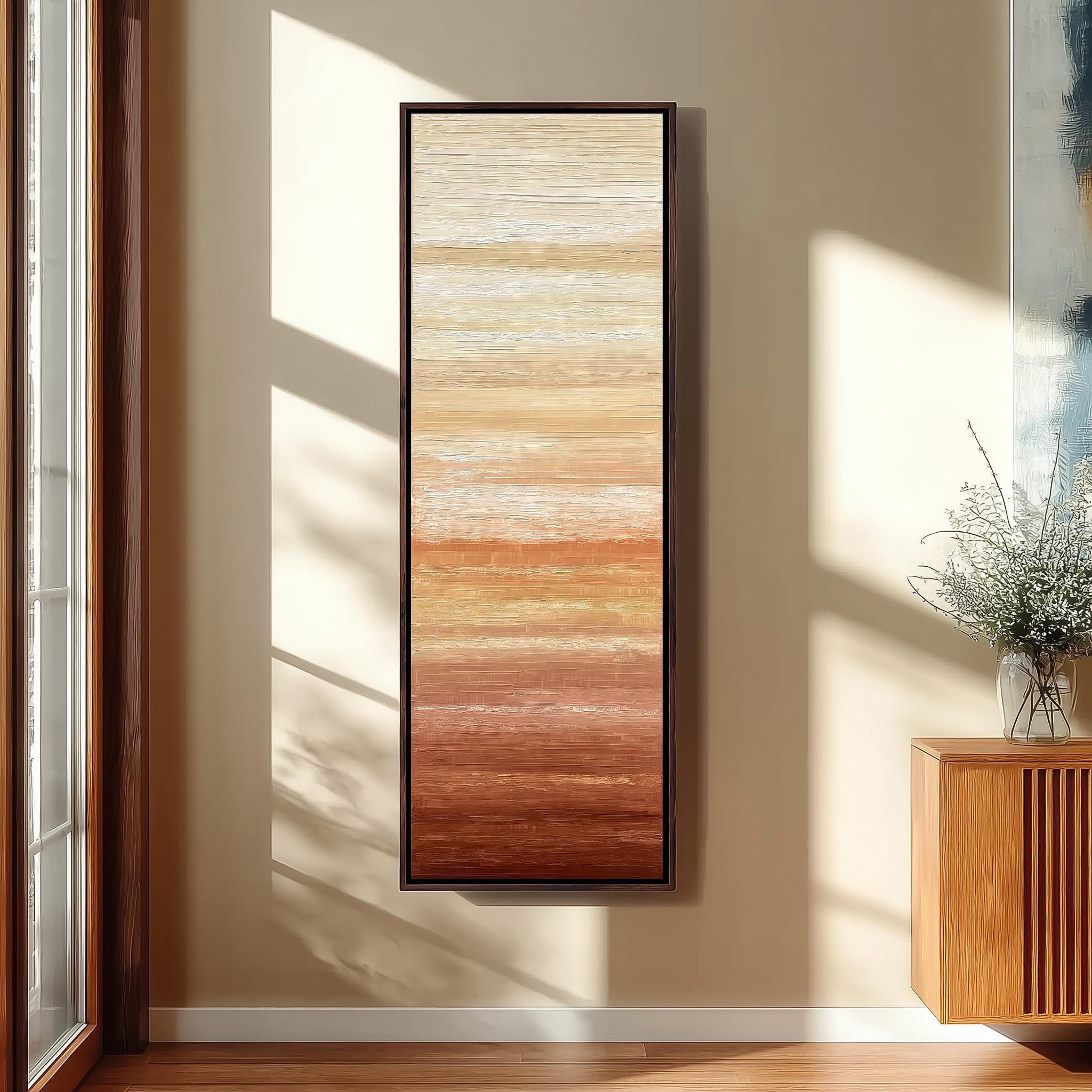 a large, rectangular painting hanging on a wall in a room with a wooden floor and a window.