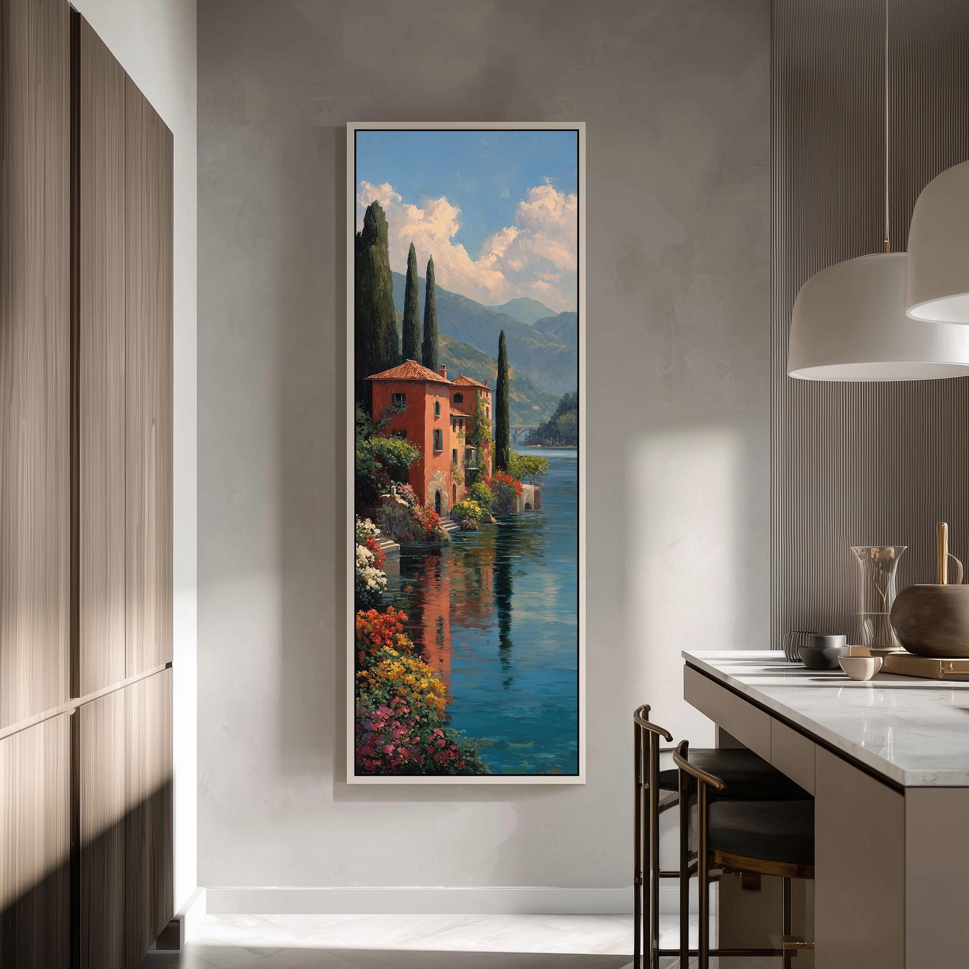 a large, framed painting of a picturesque Italian landscape, depicting a red-roofed building surrounded by lush greenery and a serene body of water.