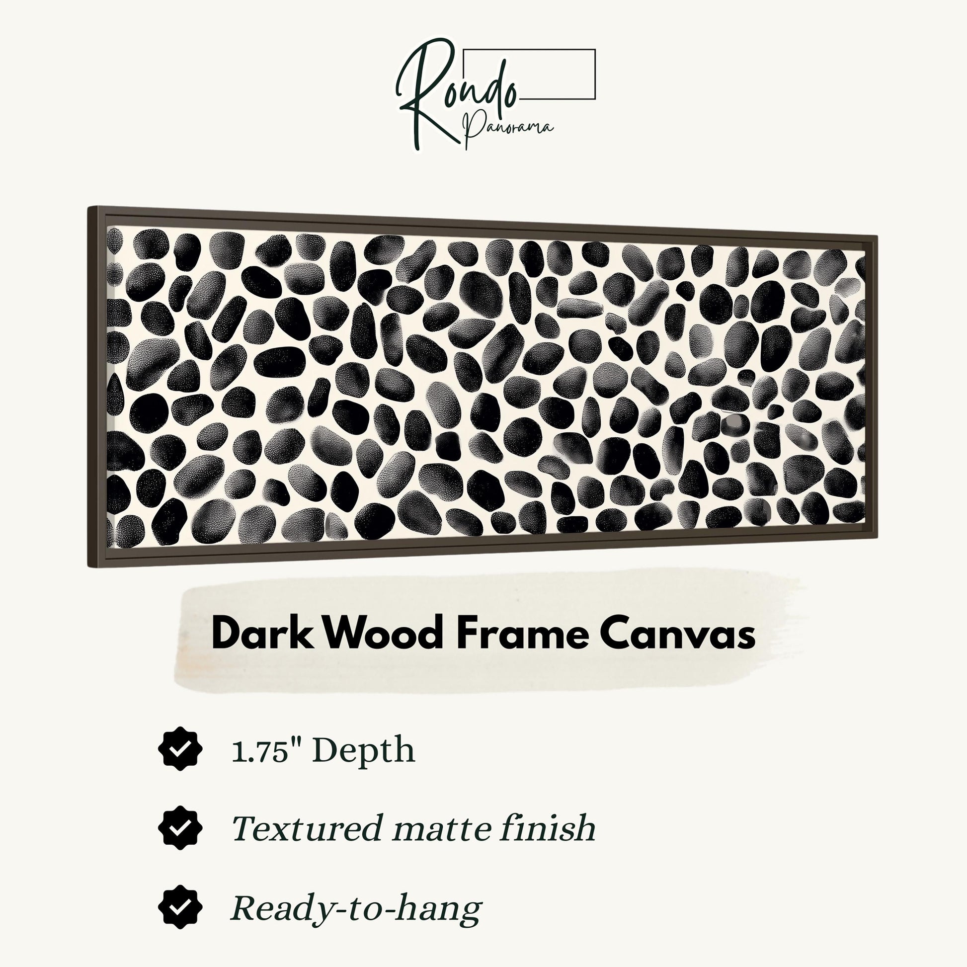 a dark wood frame canvas with a black and white speckled pattern.