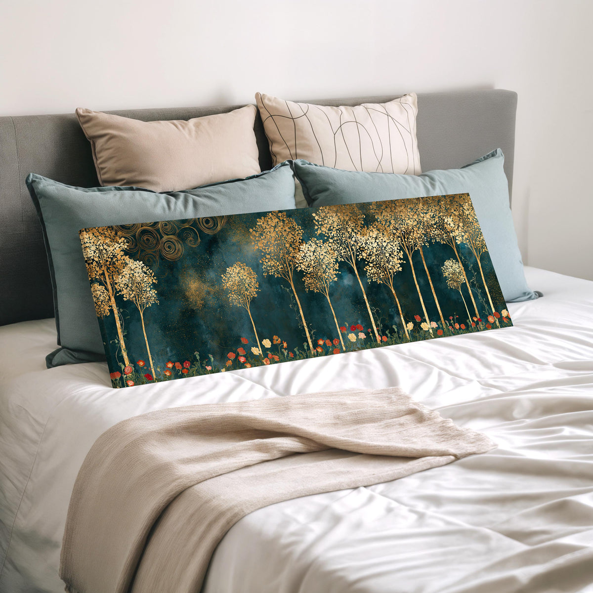 Gold leaf trees above red poppies on teal wide panoramic canvas print laid on a bed to show its size