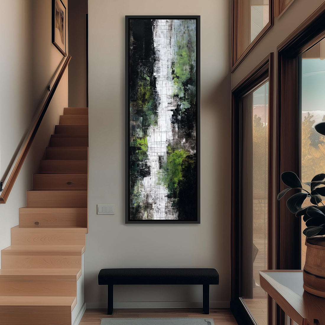 a modern interior design with a large abstract painting hanging on the wall above a black bench. The painting has a mix of green and white colors, creating a striking contrast. The room also includes a wooden staircase, a potted plant, and a window that allows natural light to enter the space.