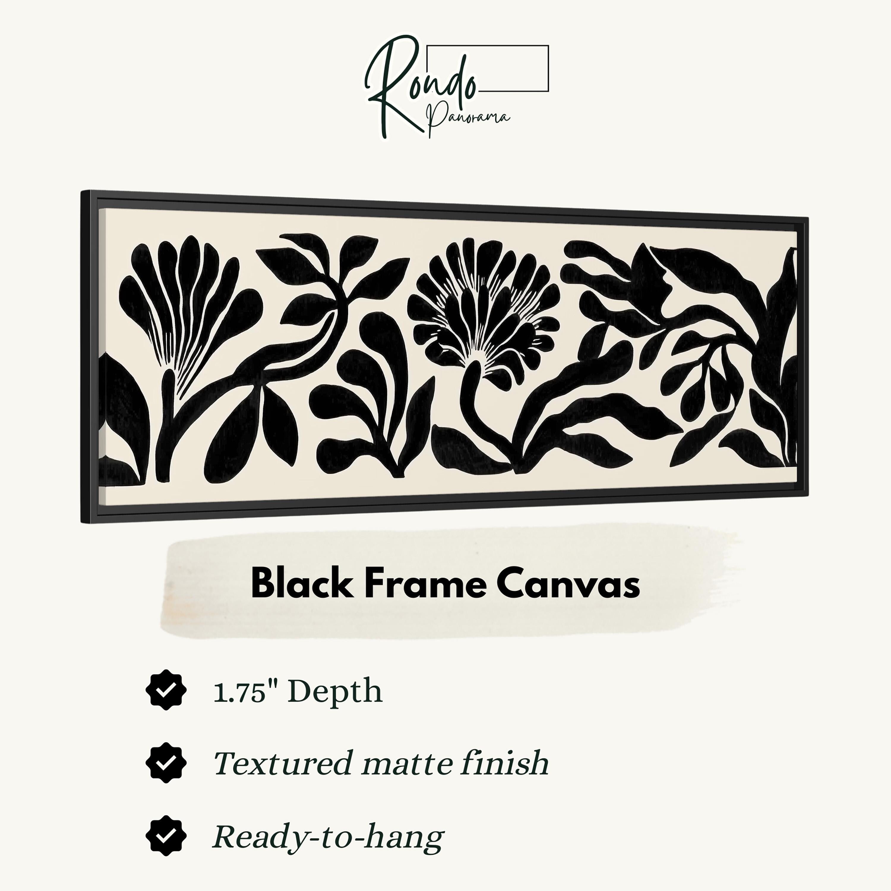 The image is a black and white framed artwork depicting a floral design with a textured matte finish.