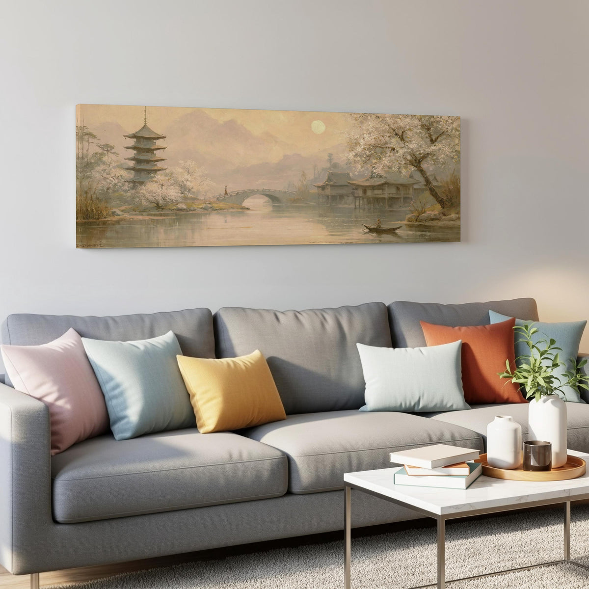 Pagoda and stone bridge at dusk panoramic canvas print above a grey sofa in a living room