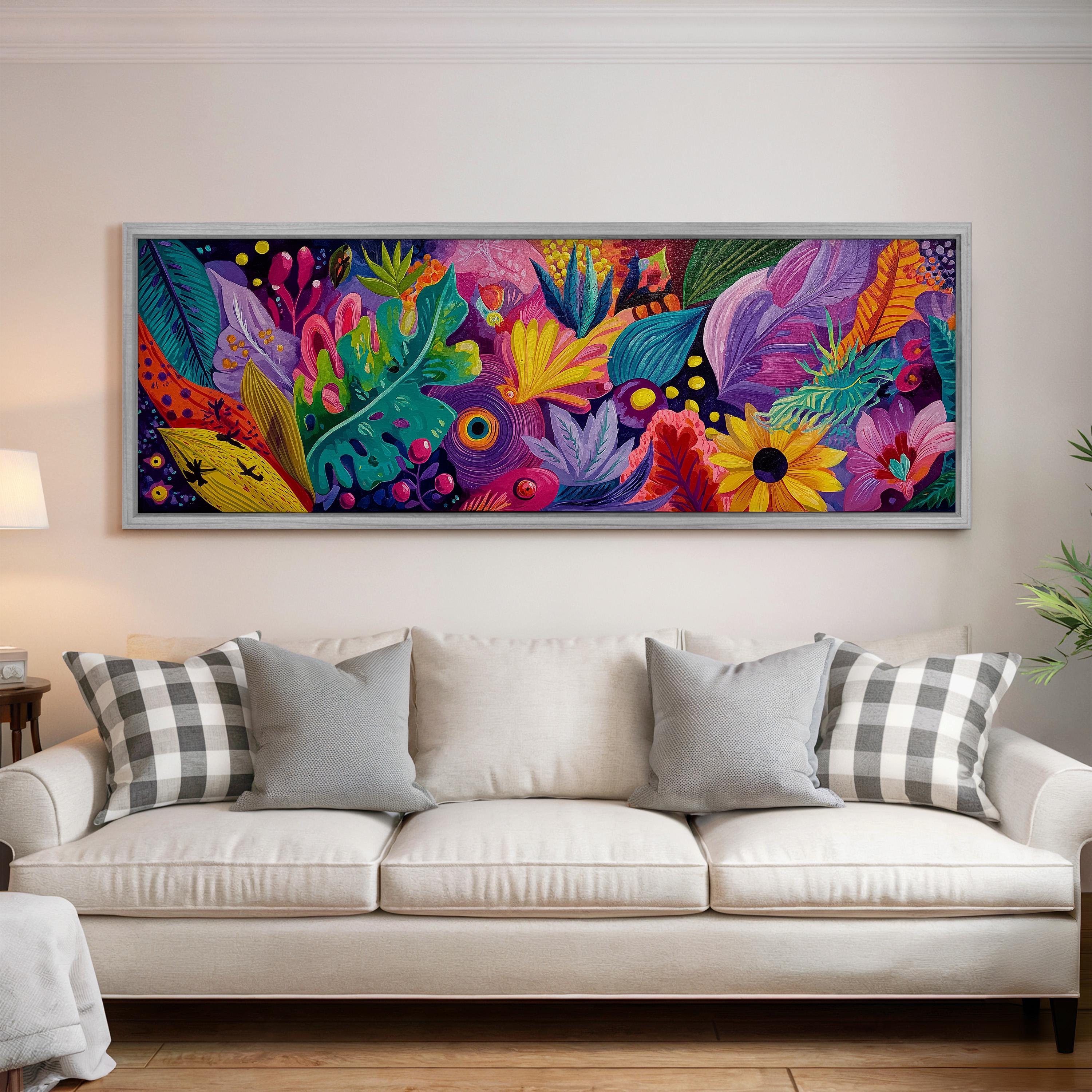 a large, colorful painting of a tropical garden hanging on a wall above a white couch with gray and white plaid throw pillows.