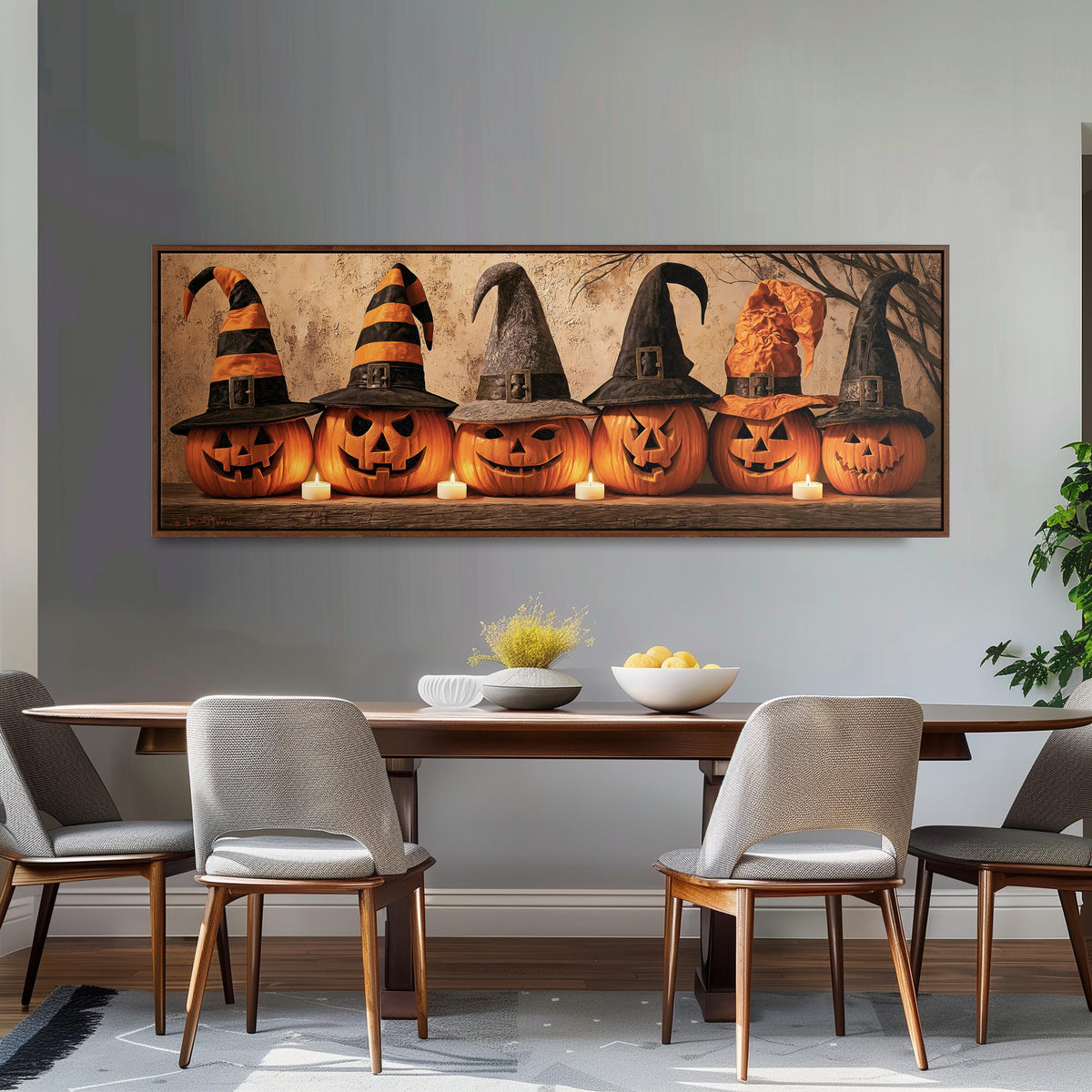 Jack-o'-lanterns wearing witch hats by candlelight long horizontal canvas print above a dining table