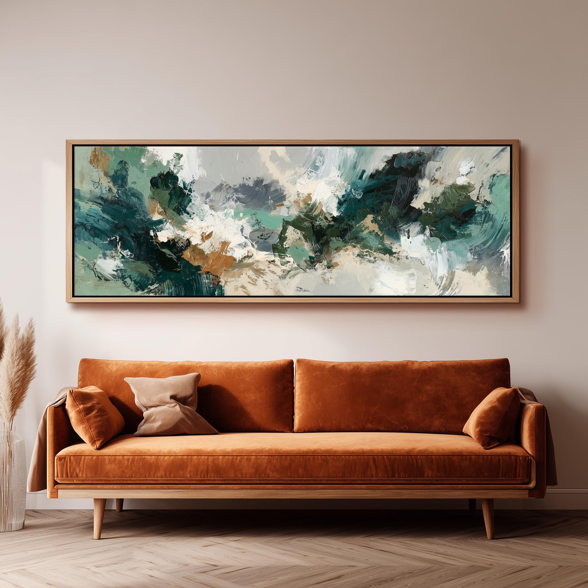 a large abstract painting hanging on a wall above a brown sofa with orange cushions.