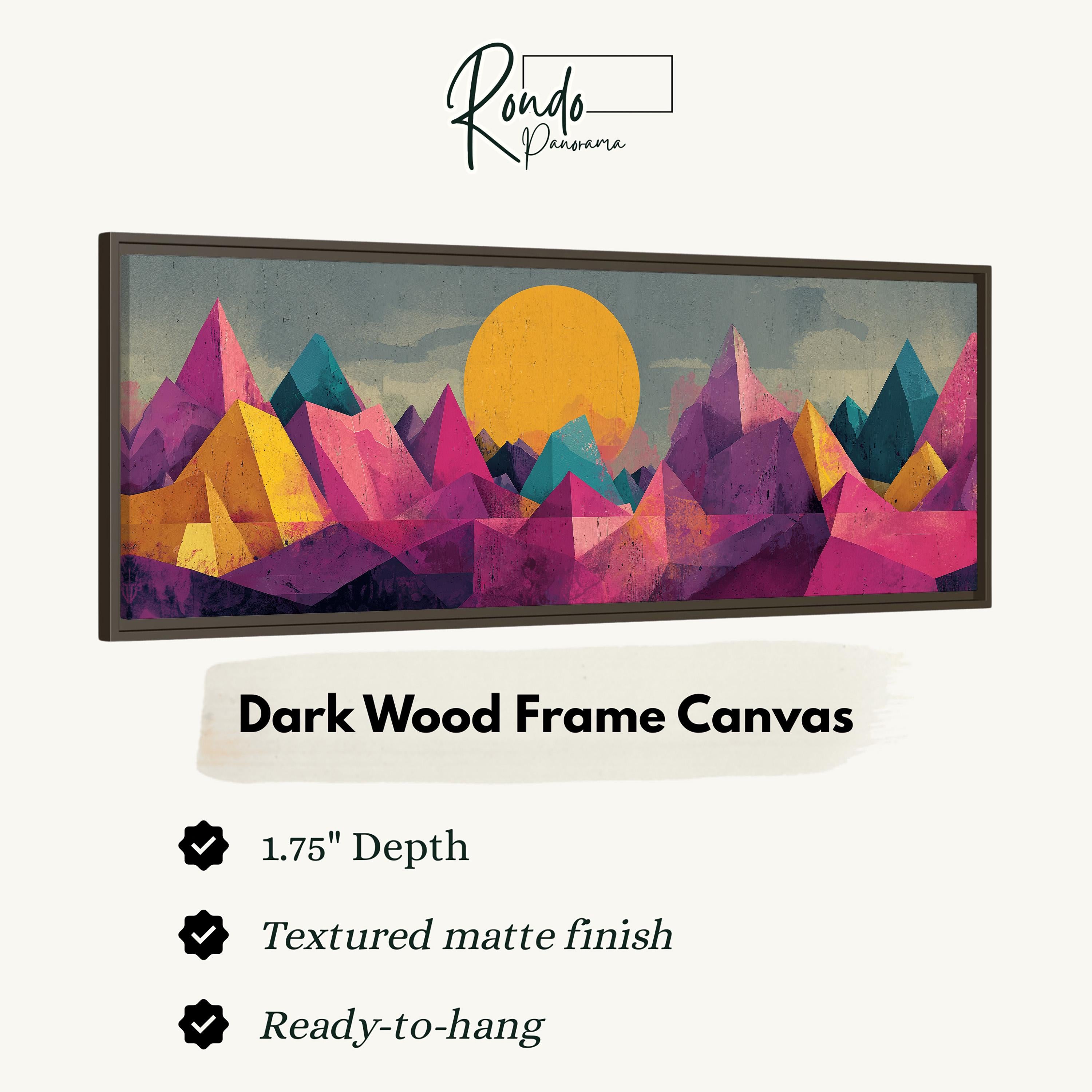 The image is a framed artwork depicting a vibrant, abstract landscape with mountains and a sun. The frame is described as a "Dark Wood Frame Canvas" with a 1.75" depth, a textured matte finish, and a ready-to-hang status.