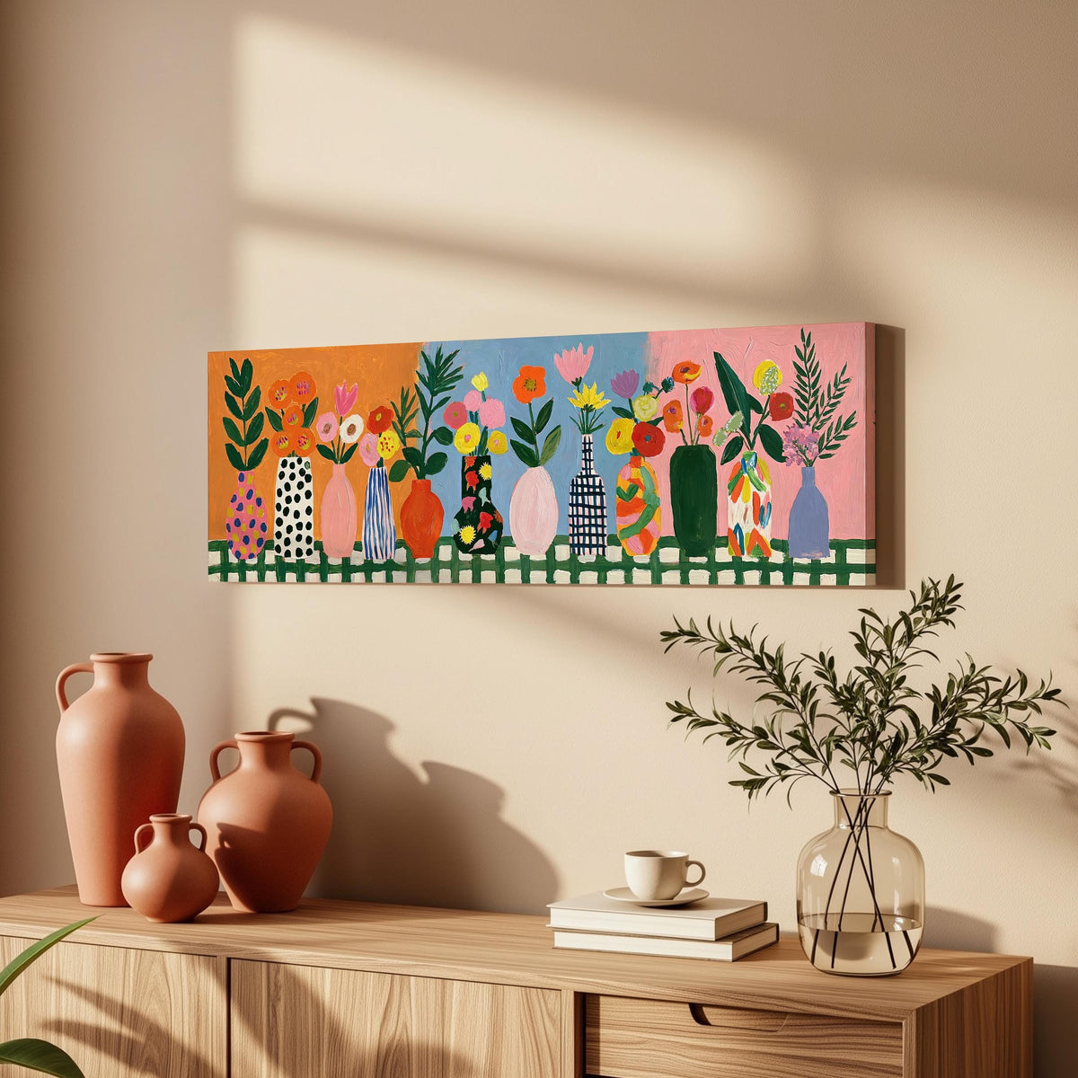 Folk art flower vases on orange and blue long horizontal canvas print above a wooden sideboard