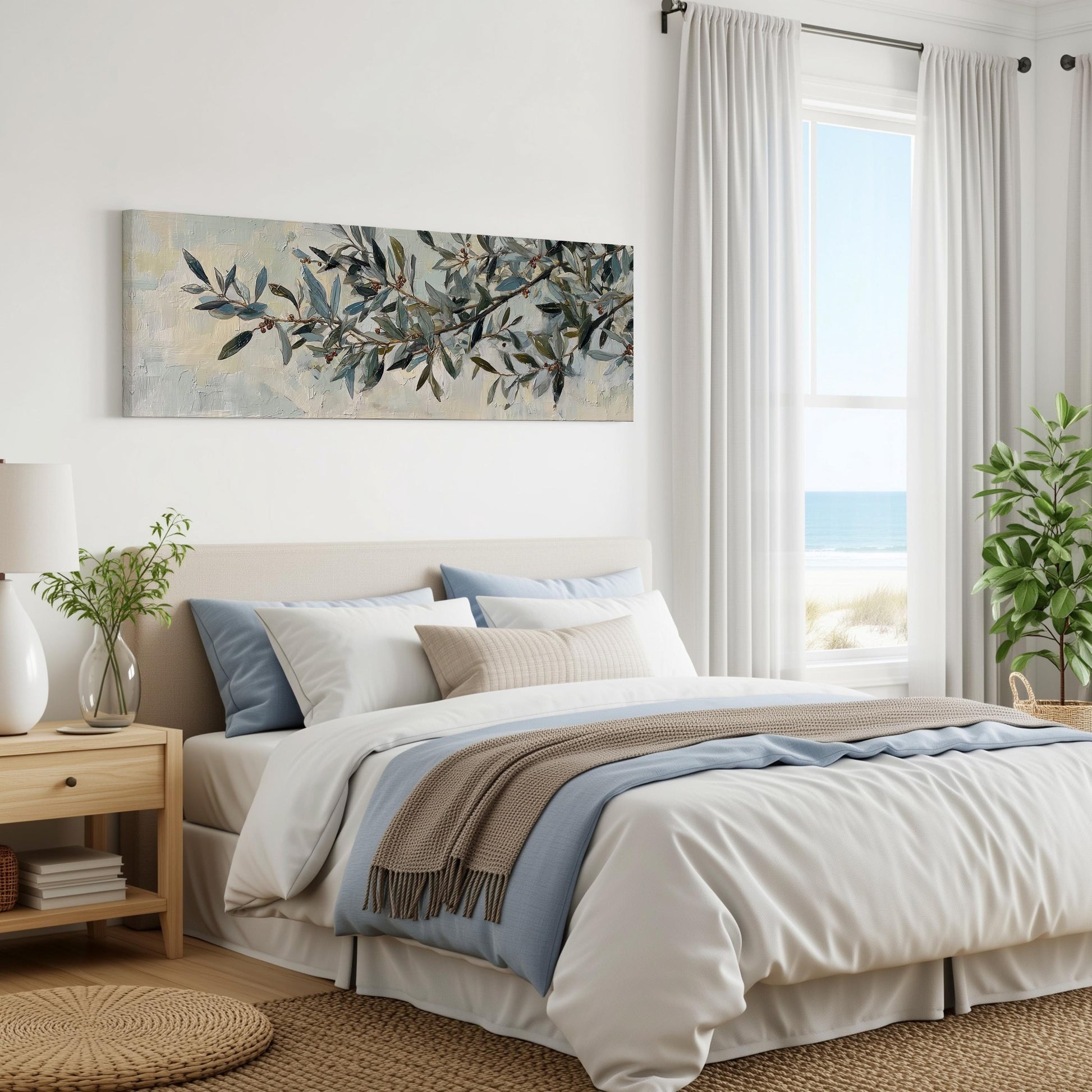 a serene and well-decorated bedroom with a large bed, a painting of leaves on the wall, and a window overlooking the ocean.