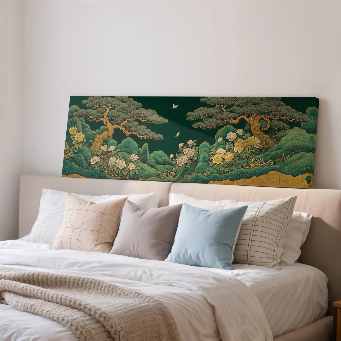 a dining room with a large, colorful painting of a landscape hanging on the wall above a wooden dining table with four chairs. The painting depicts a serene scene with trees, flowers, and a bird in flight.