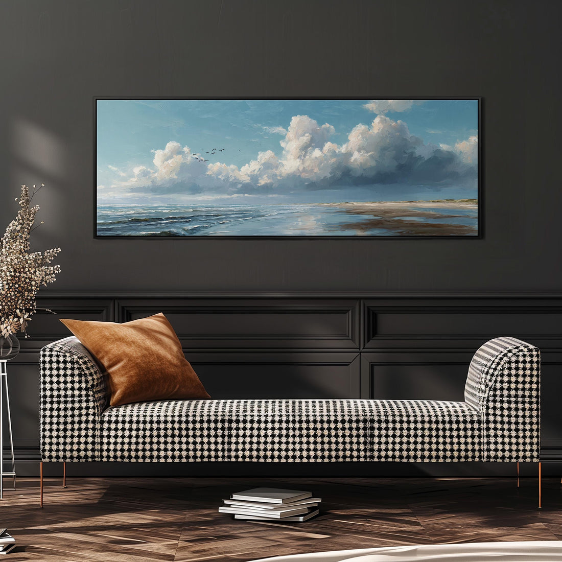 a dining room with a large painting of a serene landscape hanging on the wall above a wooden dining table with four chairs. The painting depicts a cloudy sky over a beach, with birds flying in the distance.