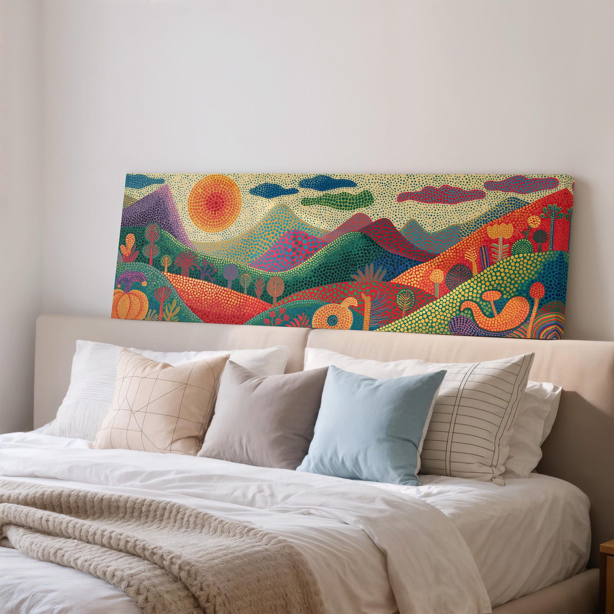 Dotted mountains under a sunburst wide panoramic canvas print above a bed in a bedroom