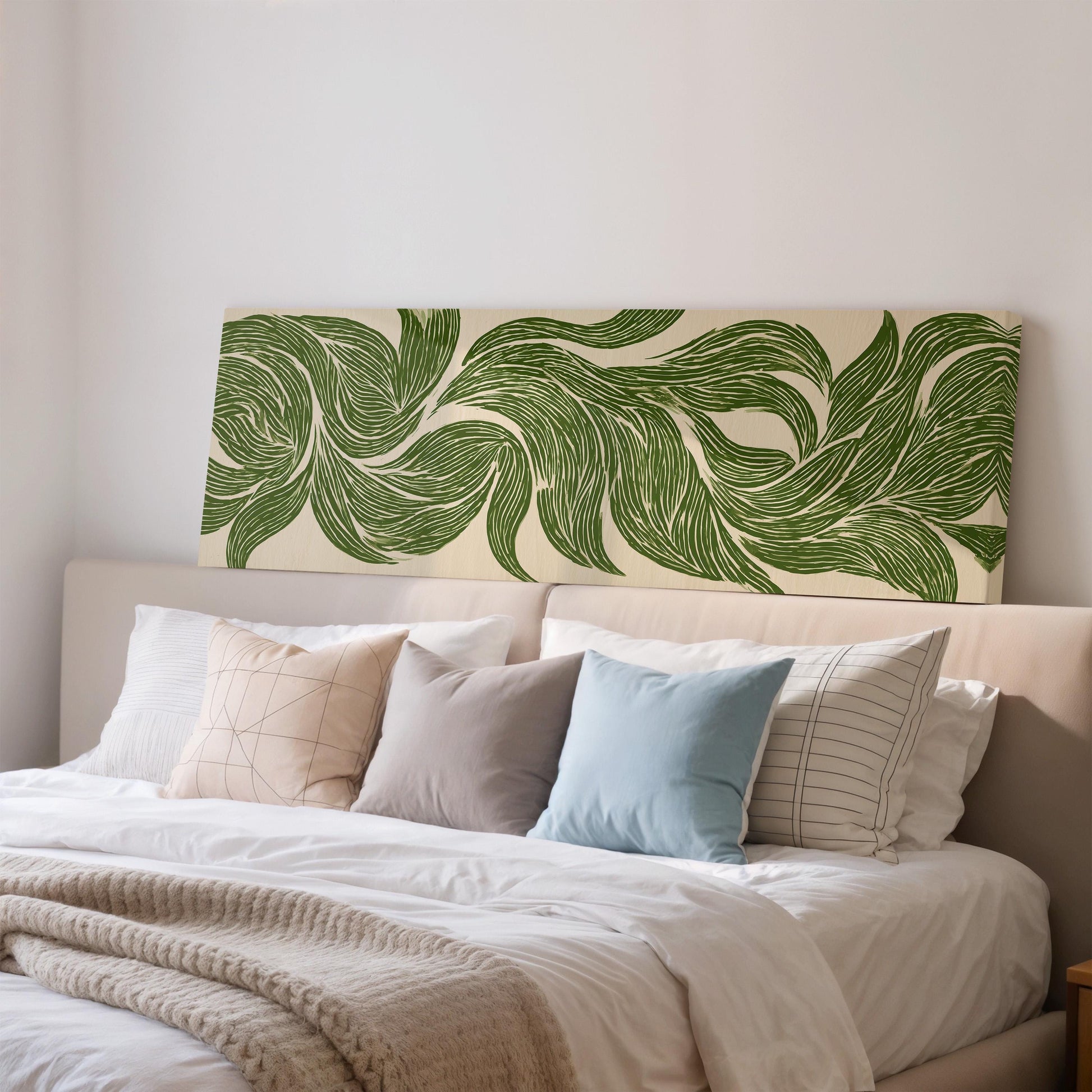 a neatly made bed with a green and white patterned headboard, featuring a variety of pillows in different colors and patterns.