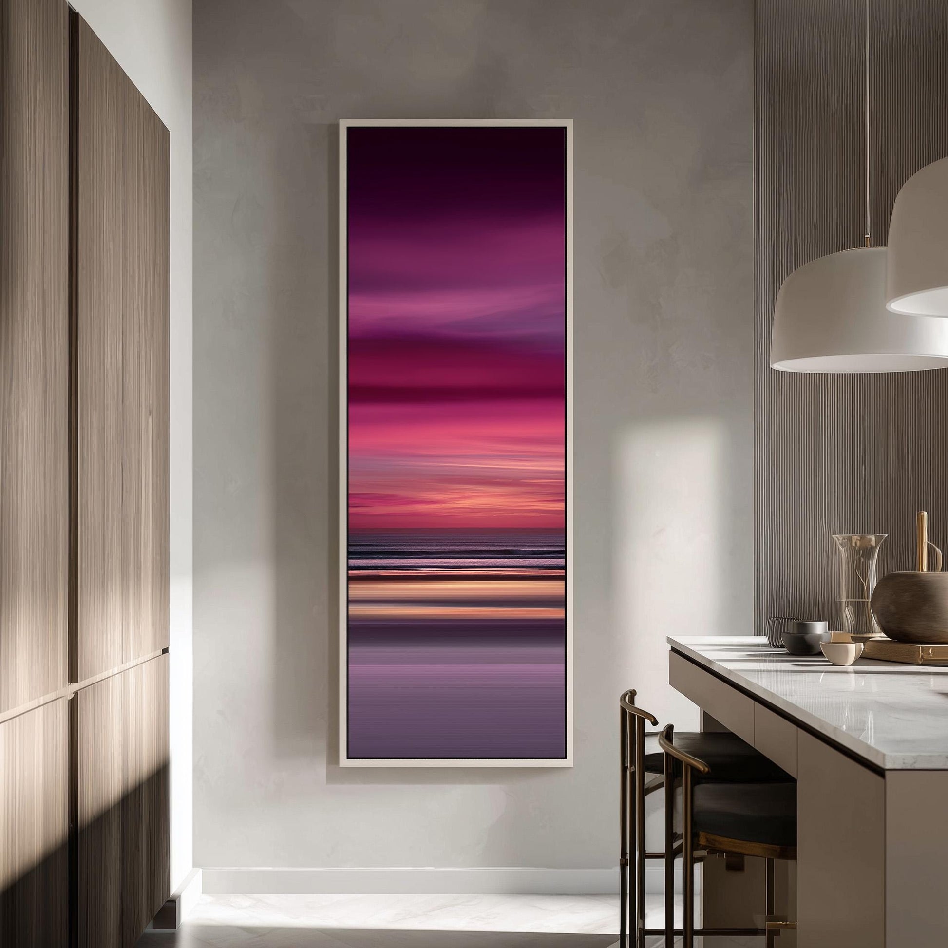 a modern kitchen with a large, colorful painting of a sunset over the ocean hanging on the wall.