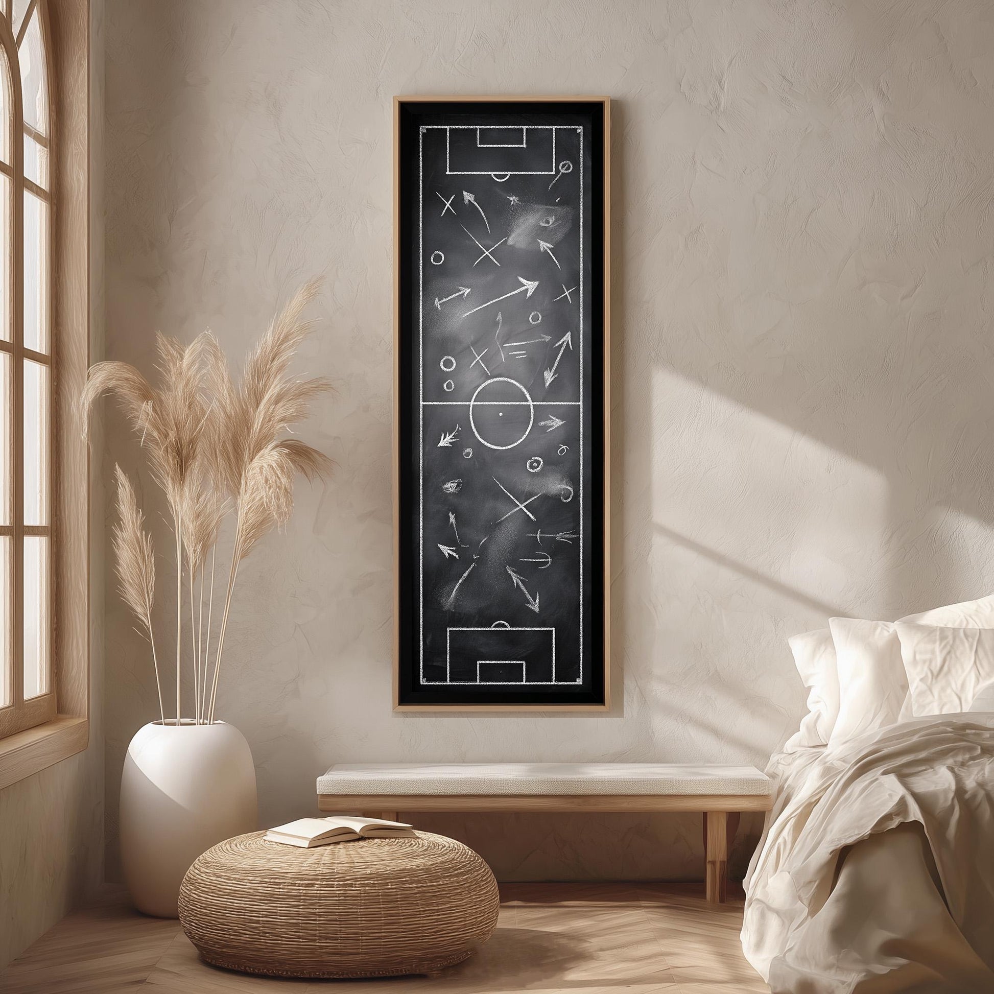 a cozy living room with a large chalkboard artwork hanging on the wall, depicting a soccer field with various elements such as a goal, players, and a scoreboard. The room is decorated with a potted plant, a bench, and a woven ottoman, creating a comfortable and inviting atmosphere.