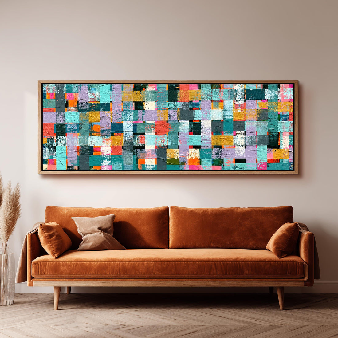 Woven grid of teal and pink blocks long horizontal canvas print above a sofa in a living room